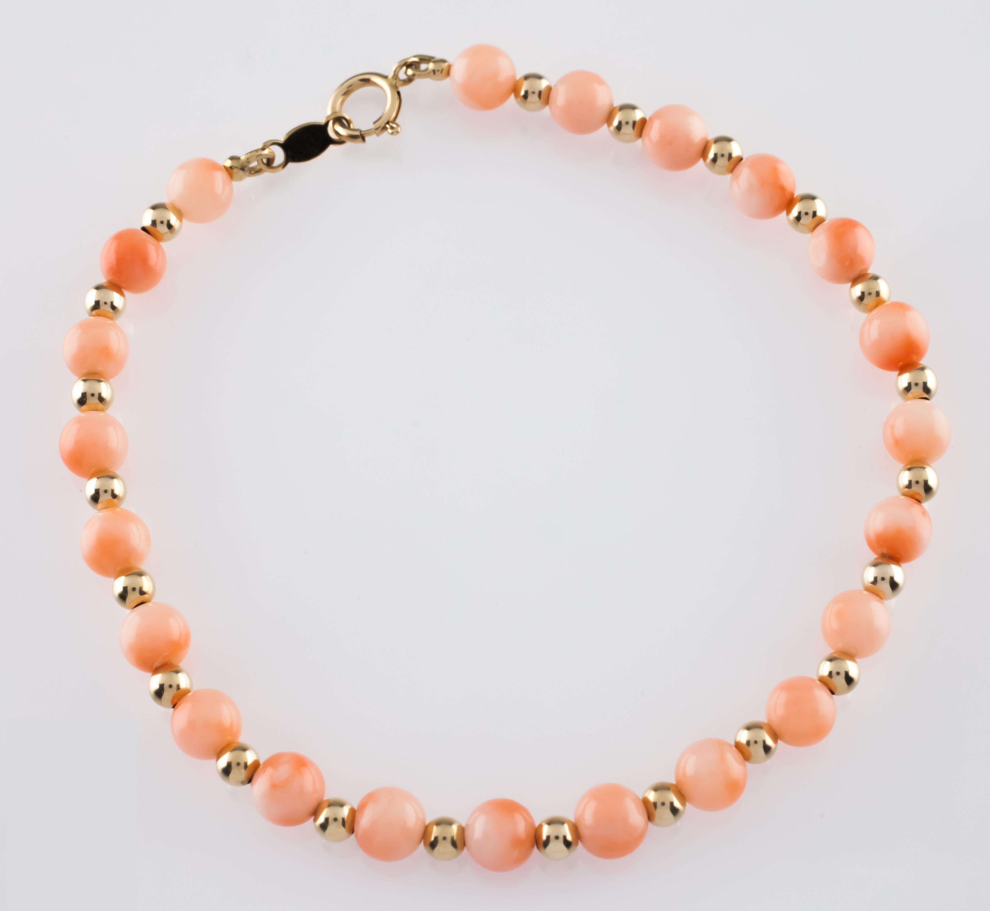 Gorgeous Coral Beaded Bracelet
Features Round Coral Beads (Appx 4-5 mm in diameter) interspersed with small gold beads (appx 2 mm in diameter)
Total Length = 6.75