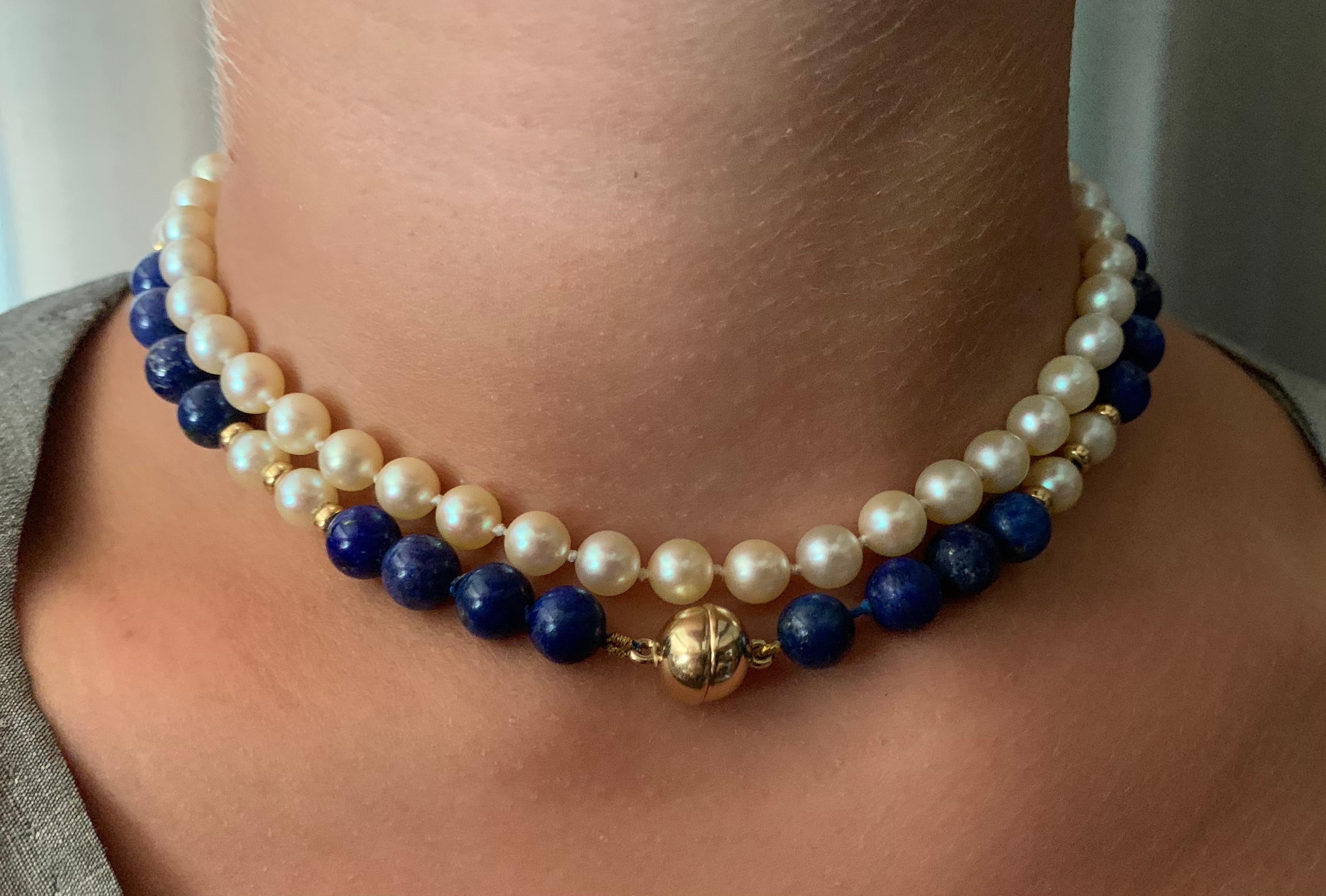 Beautiful, versatile necklace of 14k yellow gold, lapis lazuli and cultured pearls which may be worn four different ways: as a long 725mm (28.5 inch) gold, lapis and pearl necklace, as a double strand necklace, as a 370 mm (14.5 inch) lapis, gold