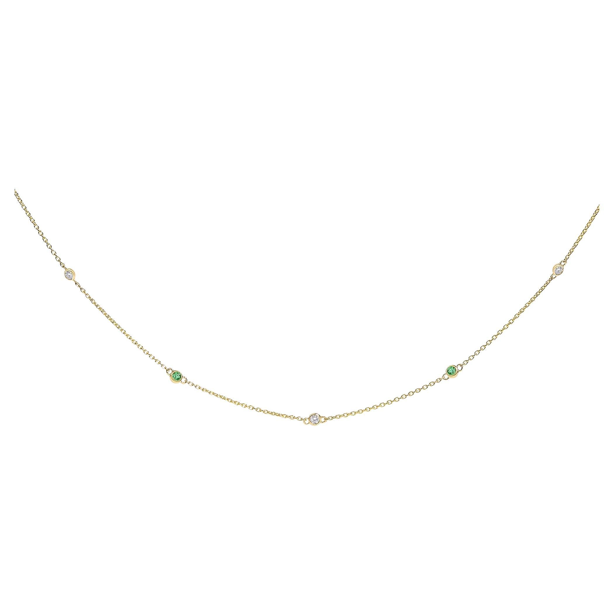 14K Yellow Gold Bezel Set Alternating Green Emerald and Diamond Station Necklace For Sale