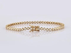 Bracciale Tennis con diamanti incastonati in oro giallo 14K