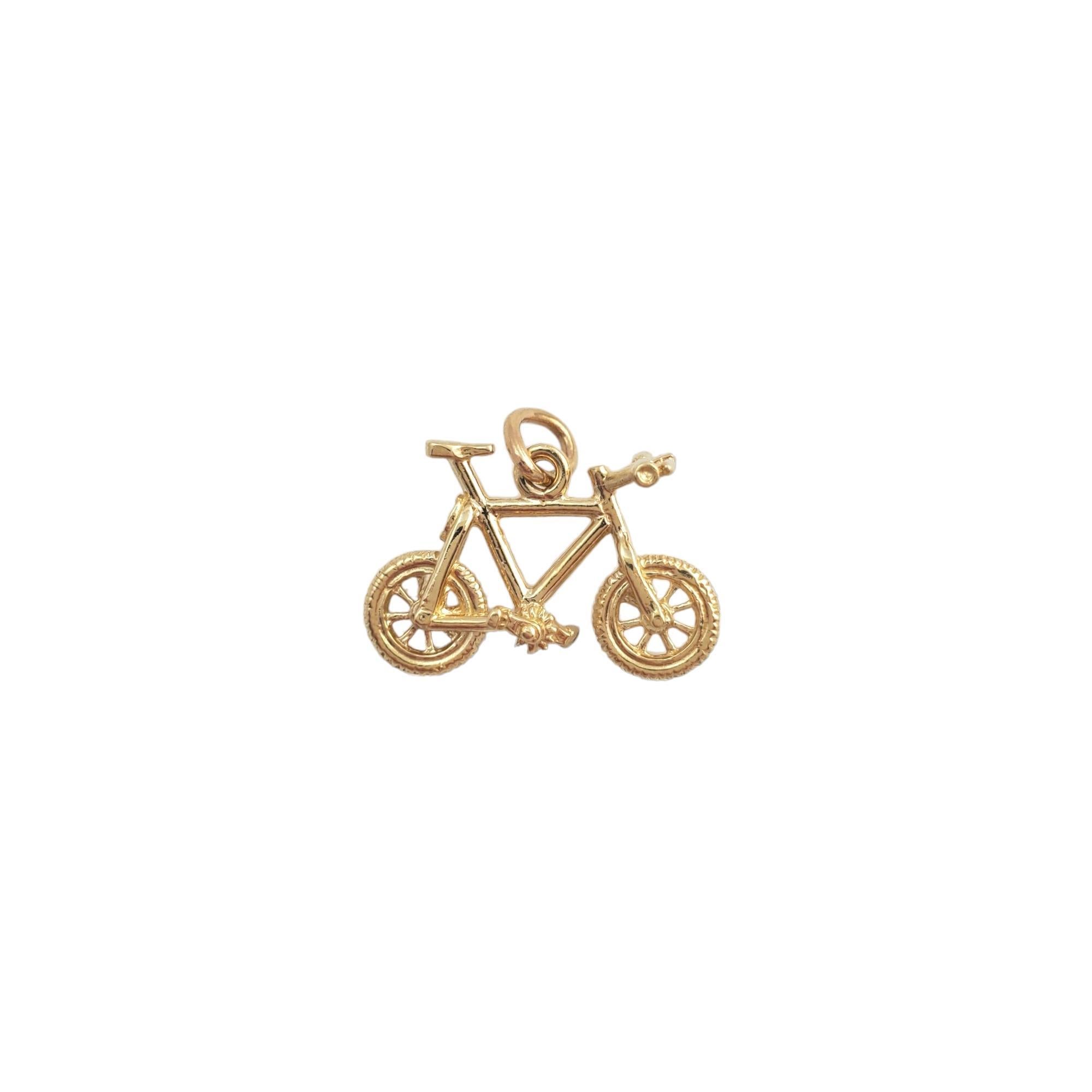 Vintage 14 karat yellow gold bicycle pendant -

This lovely bicycle pendant is a symbol of exploration and is set in beautifully detailed 14K yellow gold.

Size: 12.6mm x 21.0mm x 9.2mm

Stamped: 14K RQC

Weight: 2.0 gr./ 1.2 dwt.

Chain not
