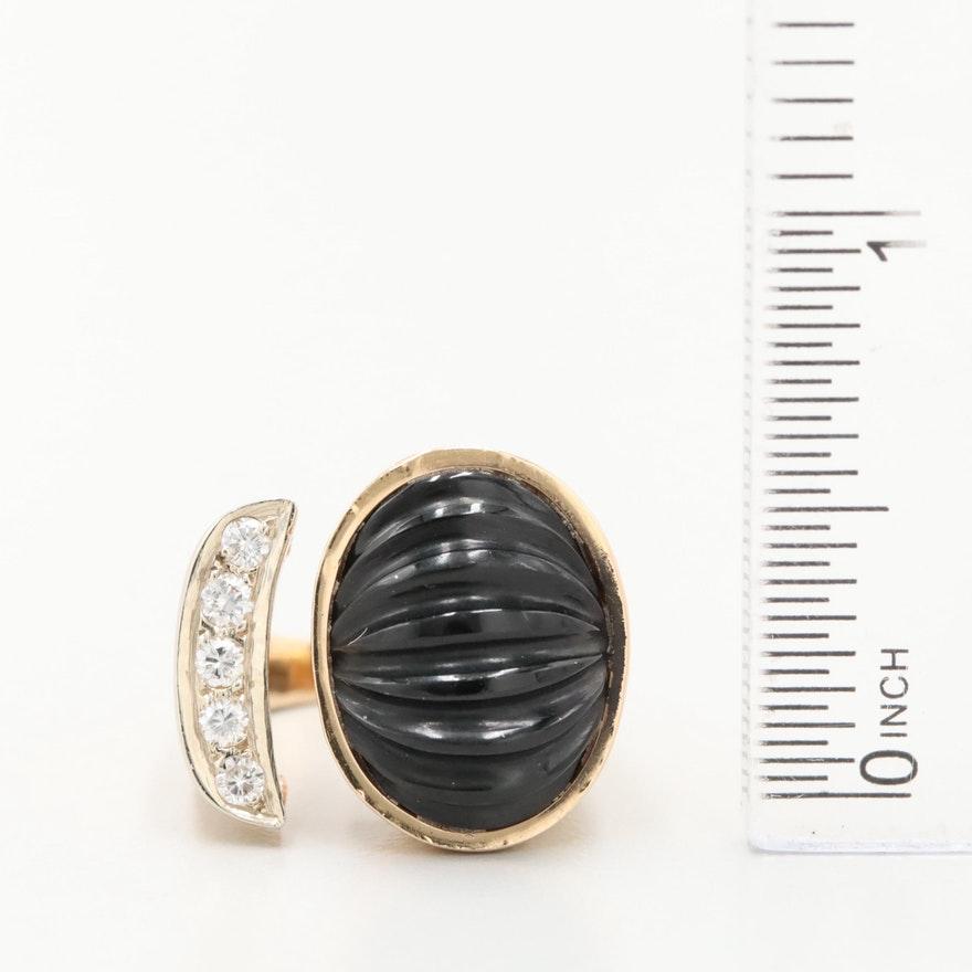 Item Details
Materials:	14K Yellow Gold
Ring Size:	4.00
Hallmarks:	14K with Pictorial Markings
Total Weight:	6.90 dwt
 	 
Center Stone Type:	Onyx
Center Stone Shape:	Oval Fluted Cabochon
Center Stone Count:	1
Center Stone Dimensions:	15.00 mm x