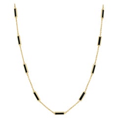 Collar de barra con incrustaciones de ónix negro y oro amarillo de 14k