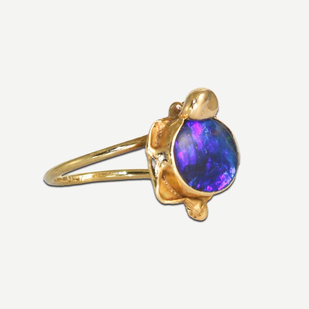14K Yellow Gold Ring with a Black Opal Doublet.
The Opal displays blue and green color flashes.
Stamped 14k on shank, weighs 3.2 grams.
Size 6; can be sized up or down one size for an additional fee.