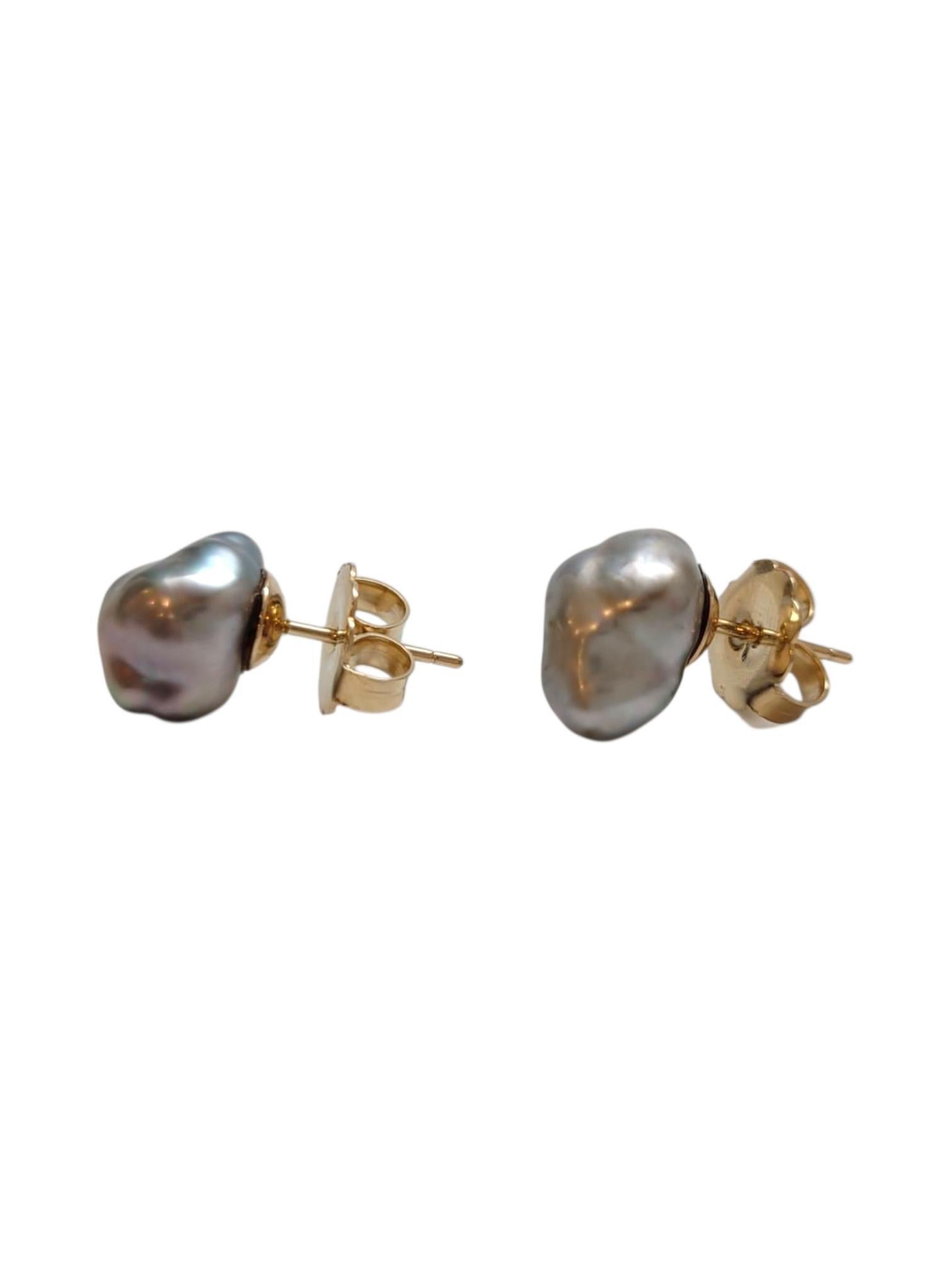 14K Yellow Gold Black Pearl Stud Earrings

Classic elegance with a twist—these black pearl studs are pure sophistication. This piece features meticulously designed stud earrings in 14 karat yellow gold with a black pearl.

Earring 1 Size: 11.3 mm X