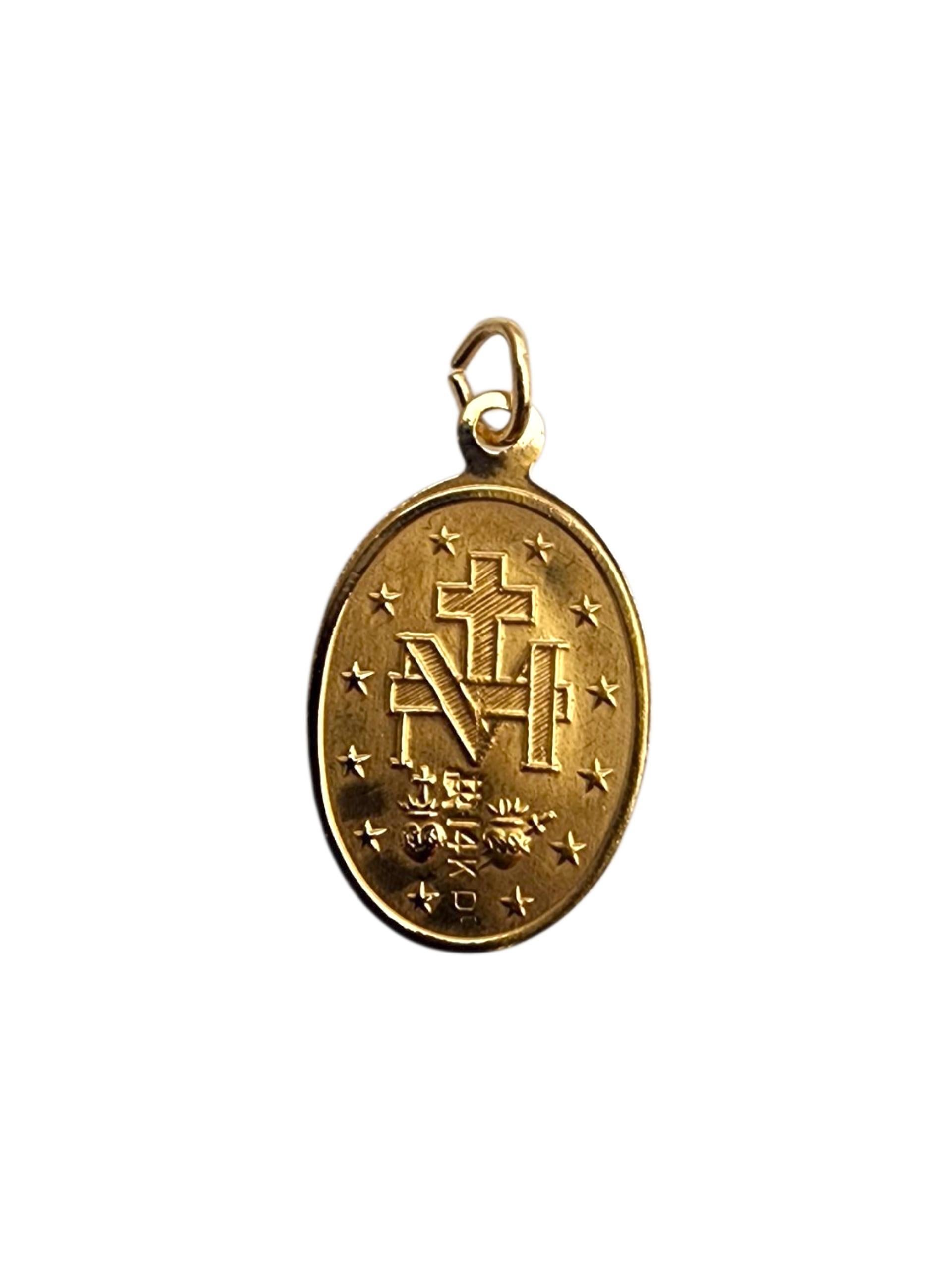 14K Yellow Gold Blessed Mother Miraculous Medal Pendant

Perfect for everyday wear or as a meaningful gift, this pendant adds a touch of reverence and grace to any jewelry collection. This piece of jewelry depicts the Mother Mary in 14K yellow