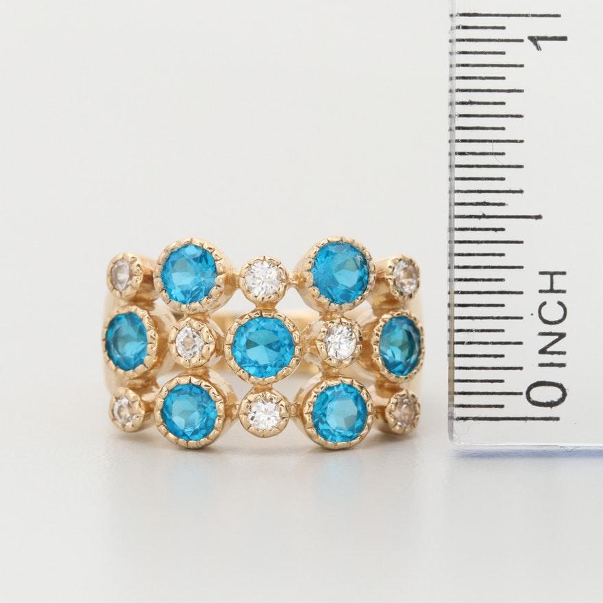 Item Details
Materials:	14K Yellow Gold
Ring Size:	8.25
Hallmarks:	14K THAILAND ISG
Total Weight:	5.00 dwt
 	 
Center Stone Type:	Apatite
Center Stone Shape:	Round Faceted
Center Stone Count:	7
Center Stone Dimensions:	4.00 – average
 	 
Side Stone