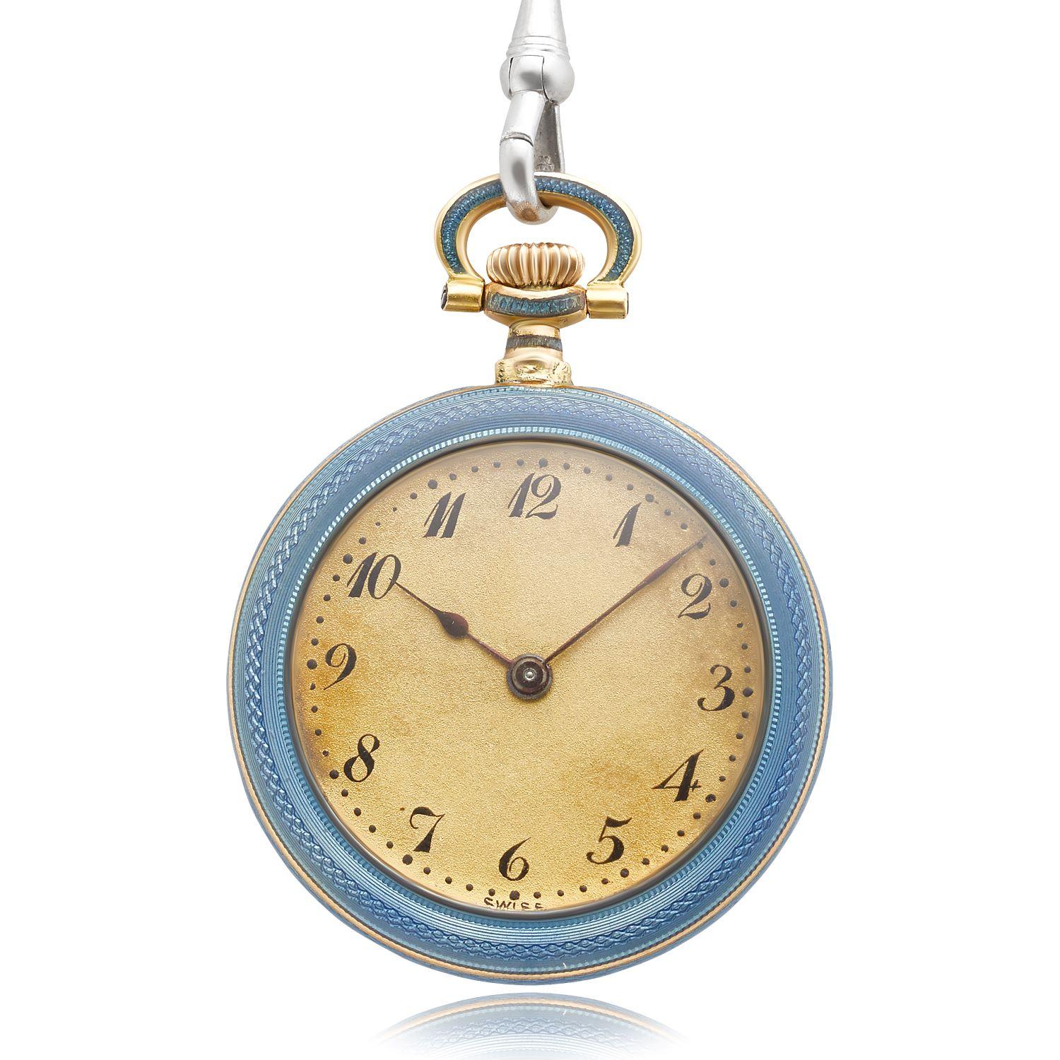 This unique Edwardian era pendant watch necklace is crafted with 14 karat yellow gold and enamel. The back of the watch is accented with a platinum filigree design on a blue sunburst enamel case. The filigree design is set with seven rose cut