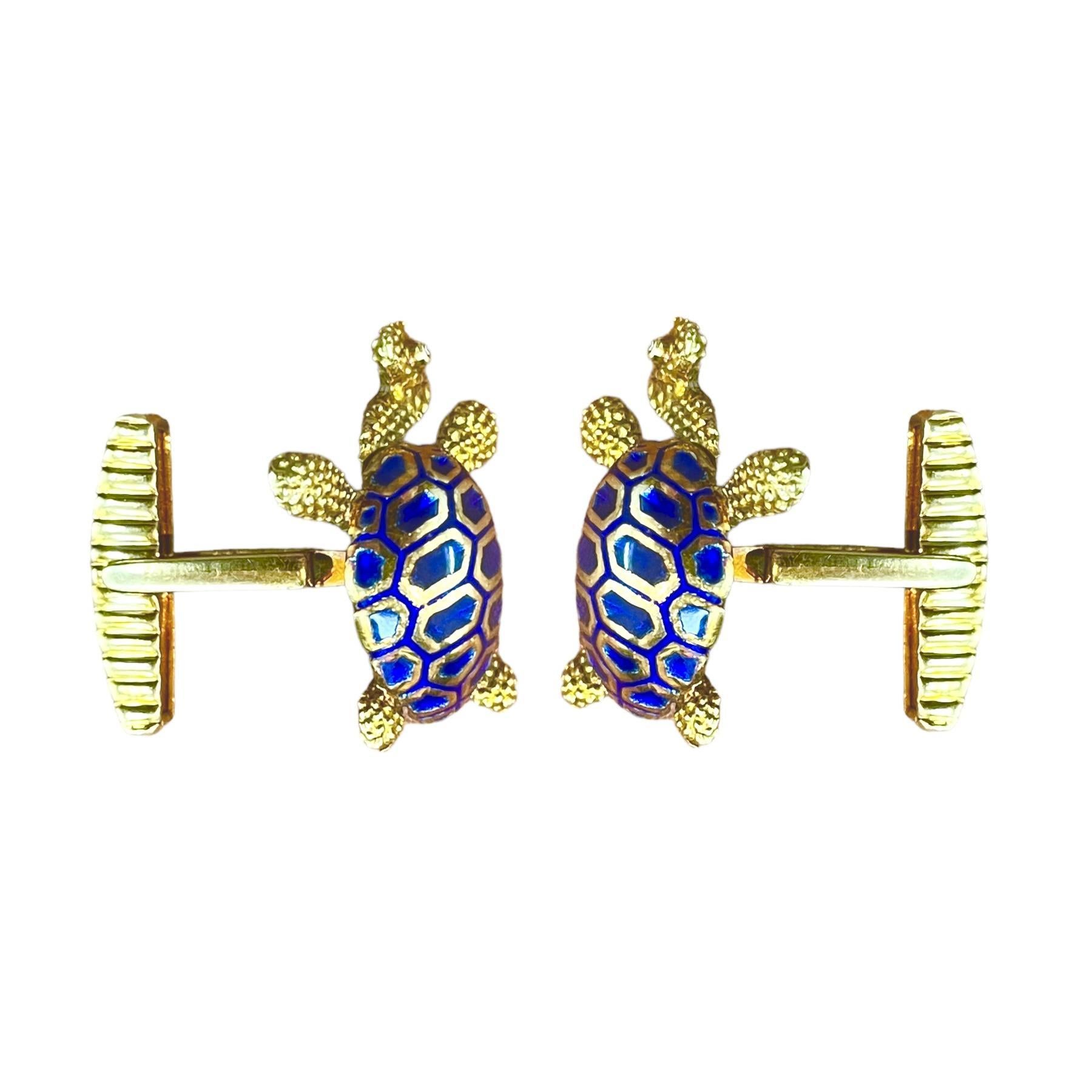 Elevate your style with these exquisite blue enamel turtle cufflinks featuring dazzling diamond eyes, set in 14K yellow gold. These meticulously crafted cufflinks are the epitome of sophistication and charm, making them the perfect accessory for any