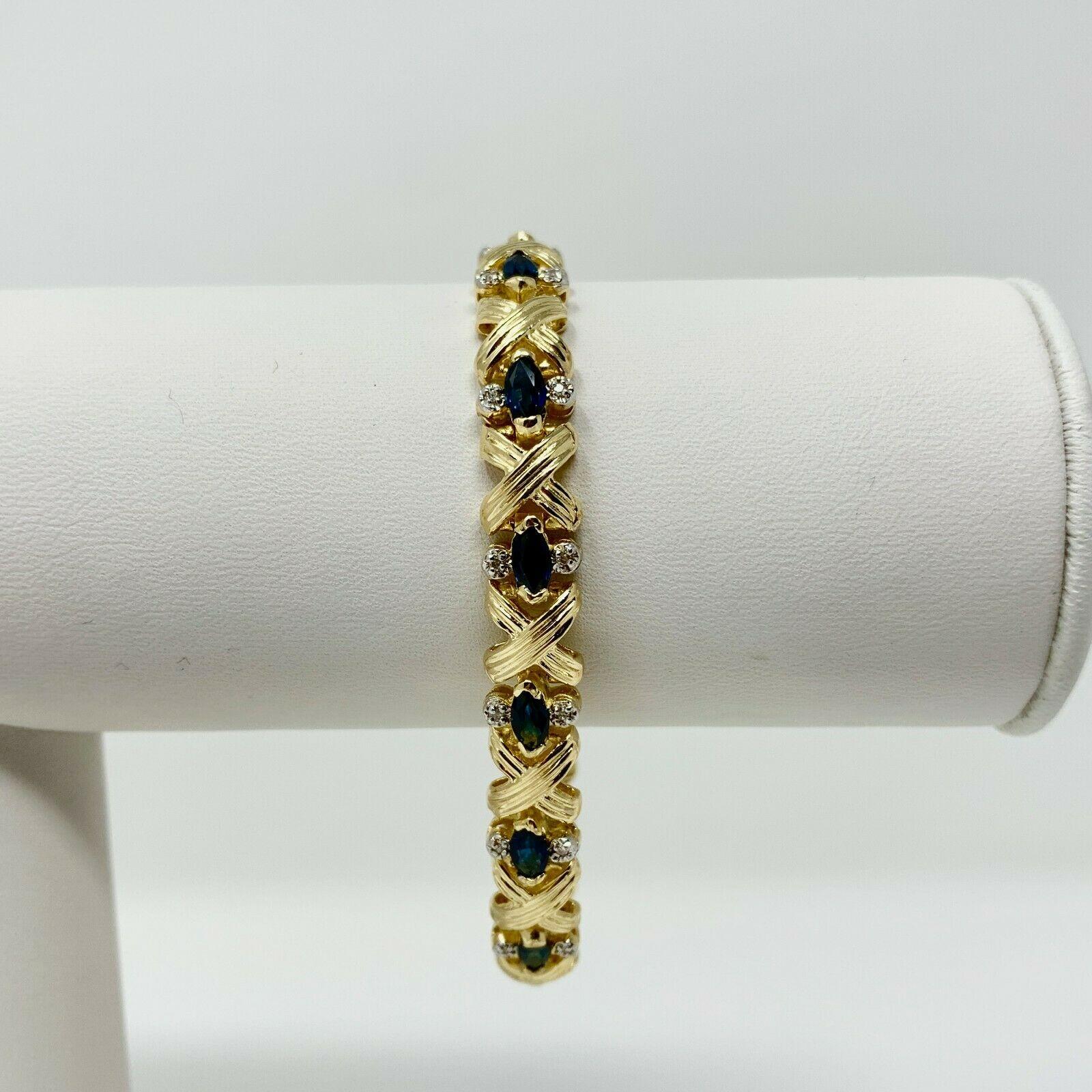 14k Yellow Gold Blue Sapphire and Diamond X Cross Link Bracelet 6.75 Inches

Condition:  Excellent (Professionally Cleaned and Polished)
Metal:  14k Gold (Marked, and Professionally Tested)
Weight:  17.7g
Length:  6.75 Inches Wearable Length
Width: 