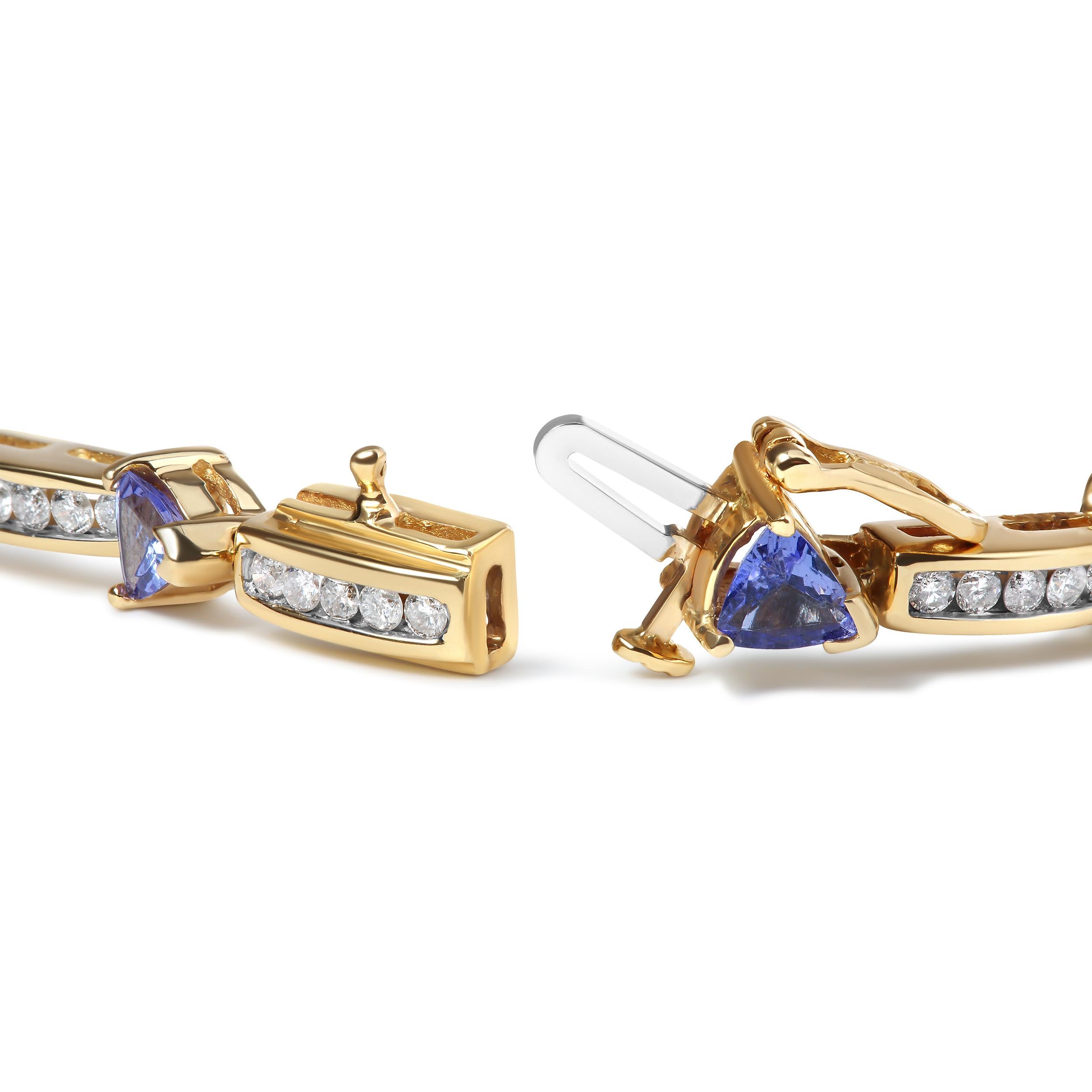 This stunning 14K yellow gold bracelet is the perfect addition to your jewelry collection. It features 12 gorgeous trillion cut blue tanzanite stones, each measuring 5 MM, that are the birthstone for December. These natural stones have been treated