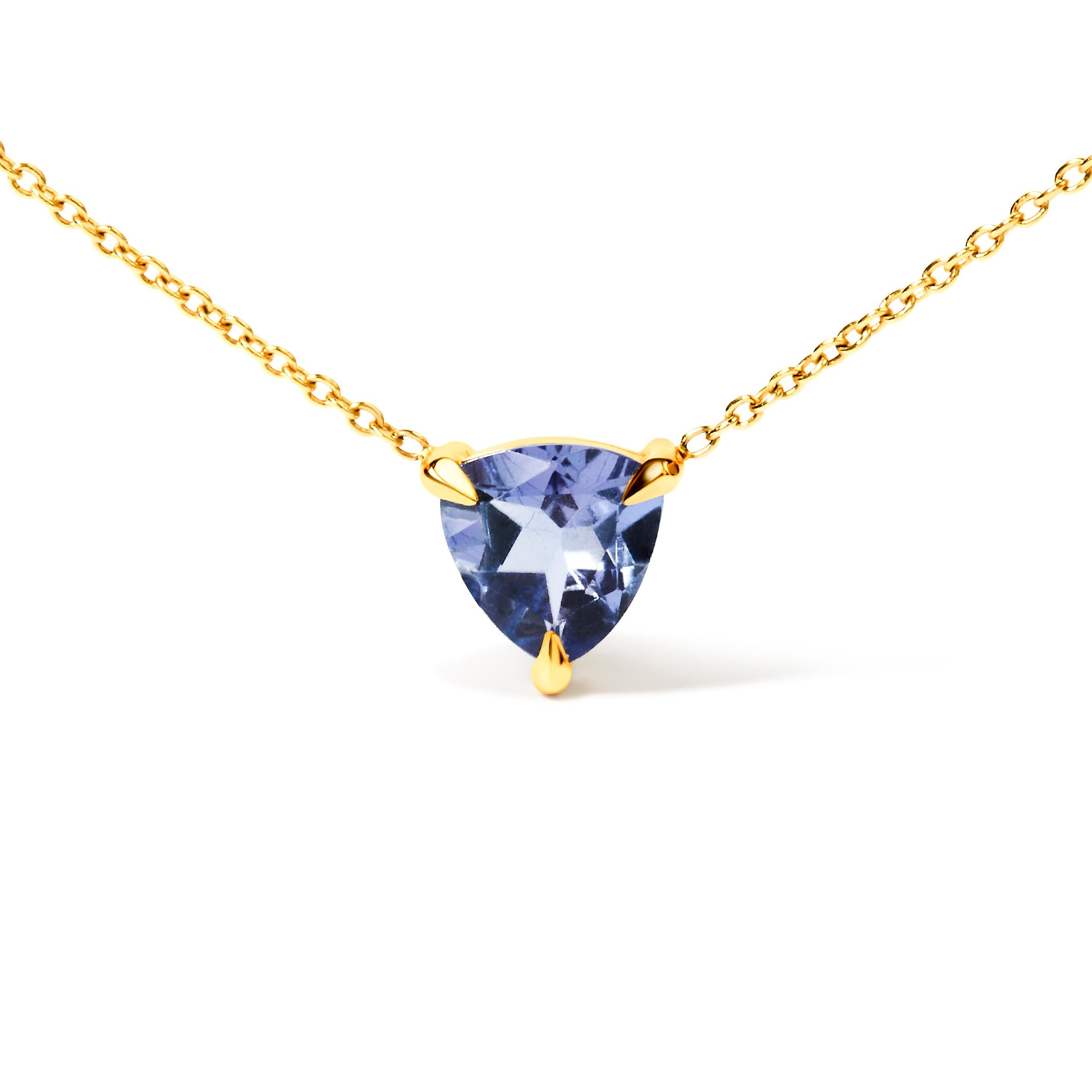 Immerse yourself in the allure of our 14K Yellow Gold 3-Prong Martini Set Blue Tanzanite Trillion Solitaire Pendant Necklace, a masterpiece of timeless beauty. Crafted from exquisite 14K yellow gold, this necklace features a stunning 7 x 6.5 mm