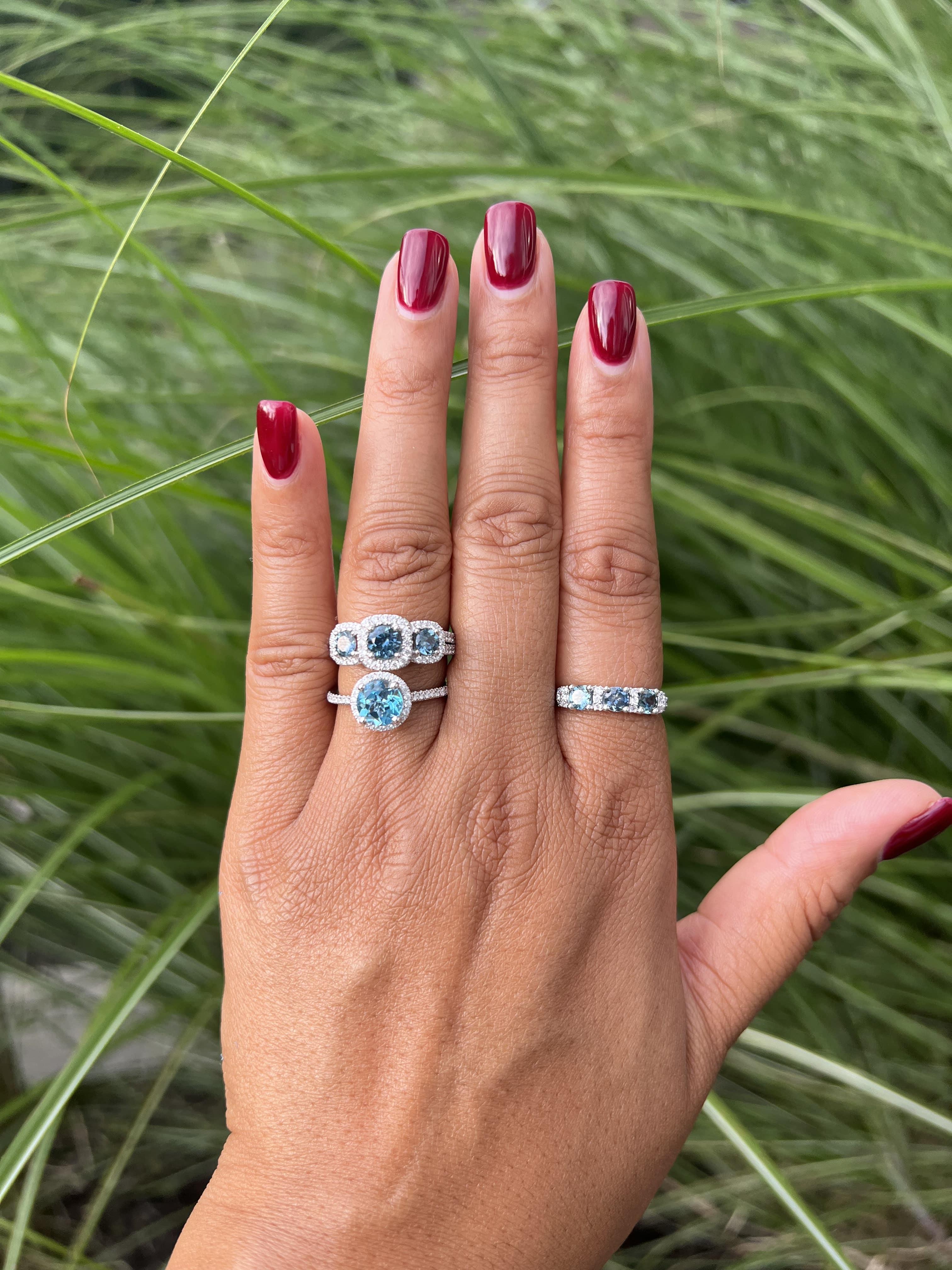 A beautiful fashion ring that can be a wedding ring or anniversary ring. This ring features a round blue topaz with a diamond halo and diamonds on the shank.

14K Yellow Gold Blue Topaz Ring with Diamonds
- Diamond weight: 0.27 ct total weight
-