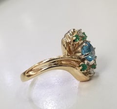 14 Karat Yellow Gold Blue Topaz, Emerald and Diamond Cluster Ring