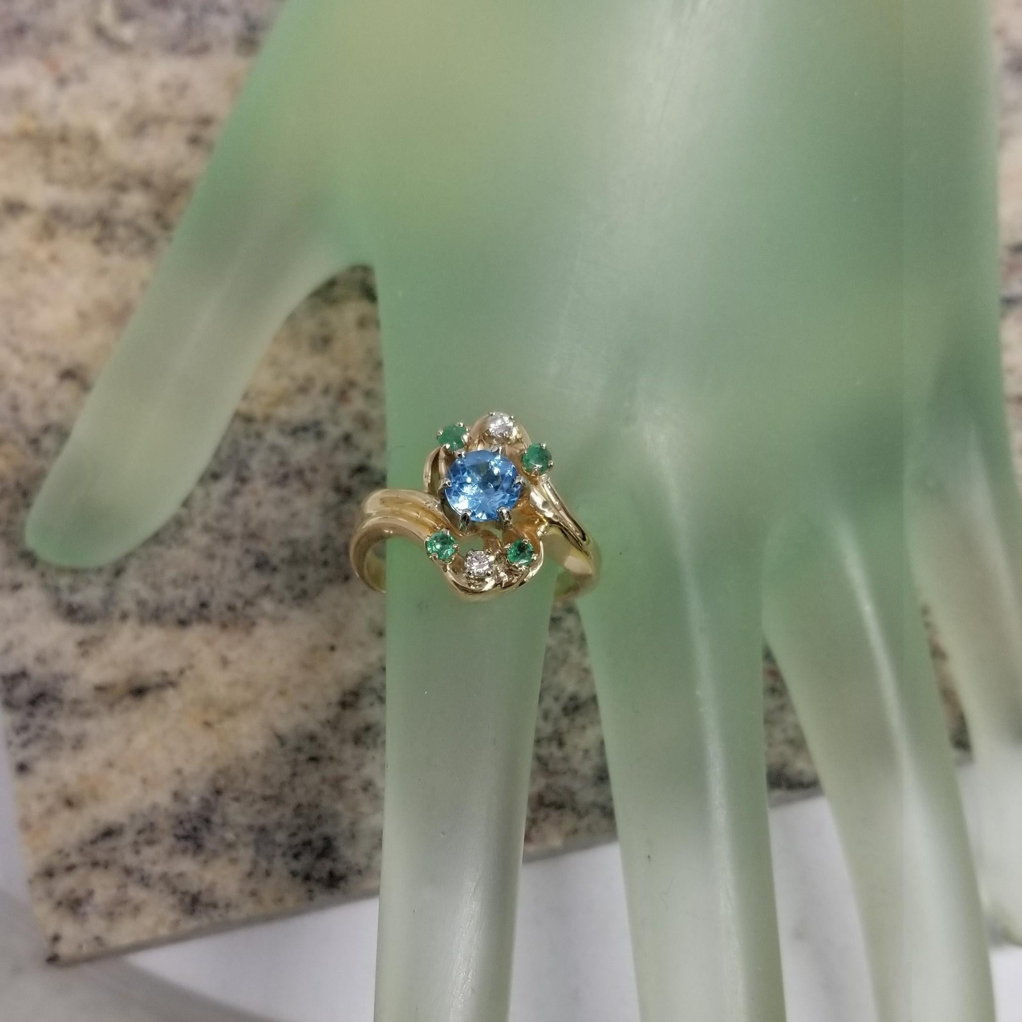 Round Cut 14 Karat Yellow Gold Blue Topaz, Emerald and Diamond Cluster Ring For Sale