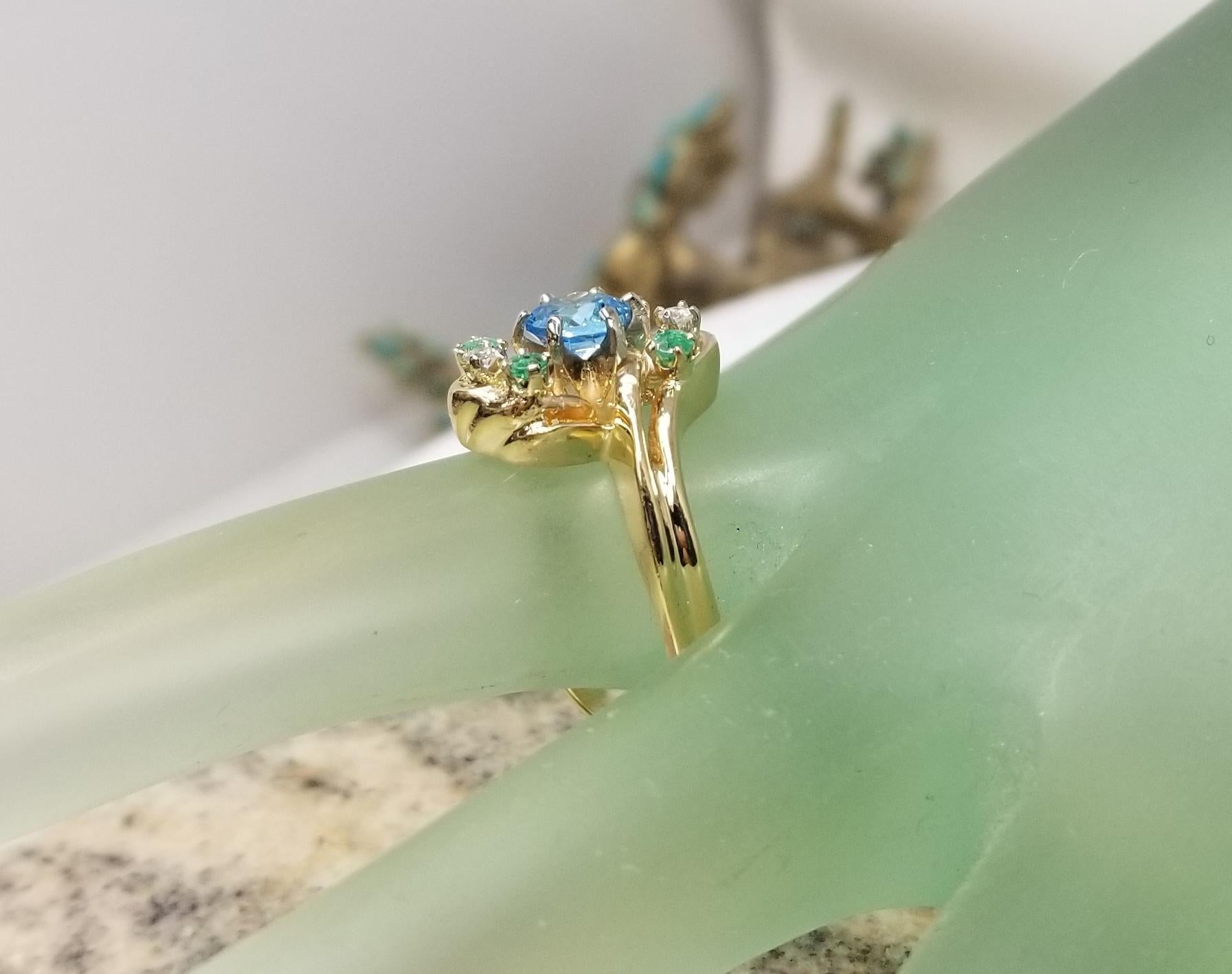 Women's or Men's 14 Karat Yellow Gold Blue Topaz, Emerald and Diamond Cluster Ring For Sale
