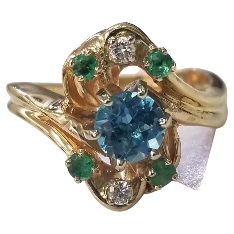 14 Karat Yellow Gold Blue Topaz, Emerald and Diamond Cluster Ring For Sale