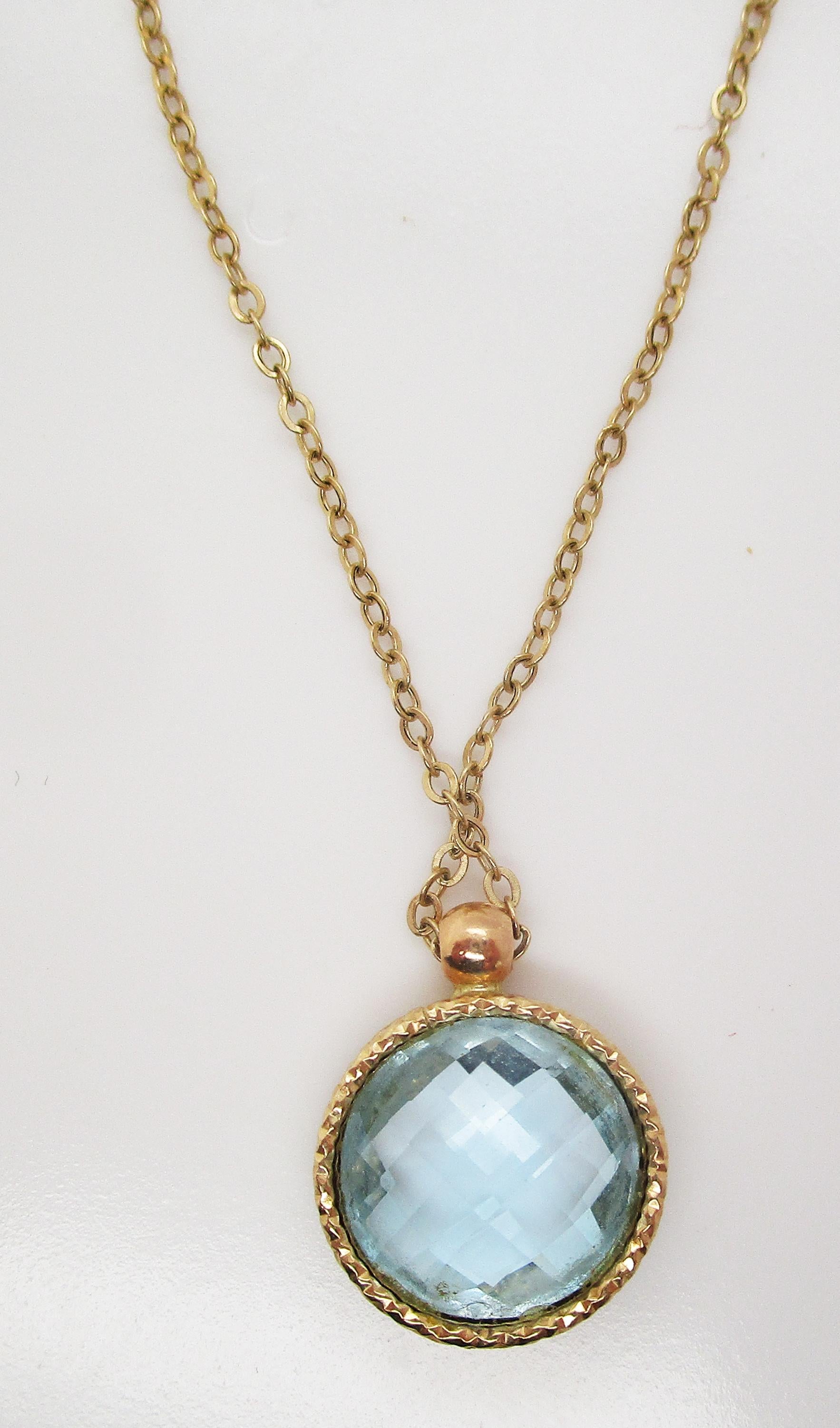 This is a lovely blue topaz pendant in 14k yellow gold on a matching chain. The delicate pendant combines the bright warmth of yellow gold with the ethereal seafoam blue of topaz in a beautiful and versatile look!
This pendant and chain would look