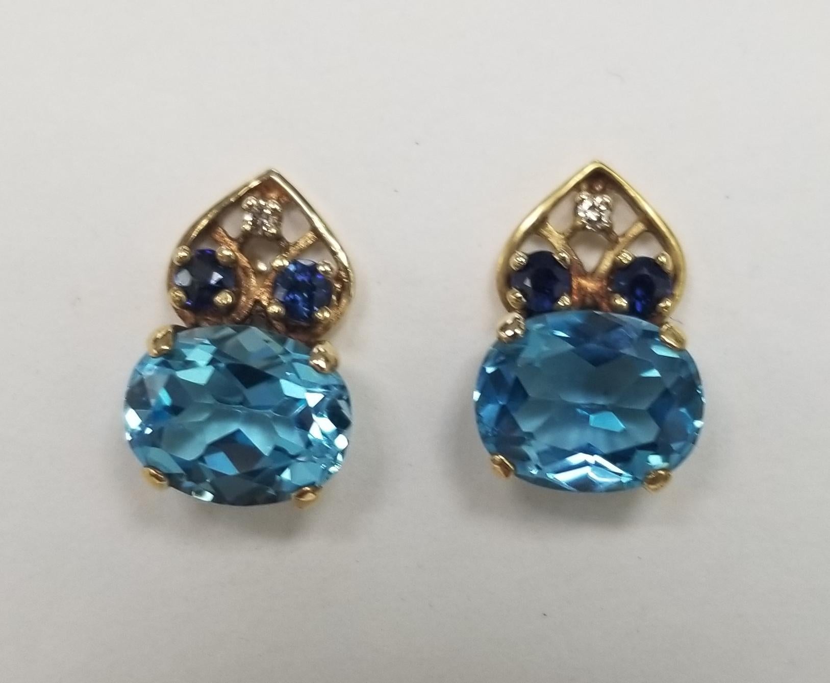 *Motivated to Sell – Please make a Fair Offer*
14k yellow gold Blue Topaz, Sapphire and Diamond ring and earring set.
 Specifications:
    main stone: 3 Blue Topaz APPROX 7.00CT
    SIDE STONES: 8 sapphires APPROX 0.45CTW
    SIDE STONES: 4 diamonds