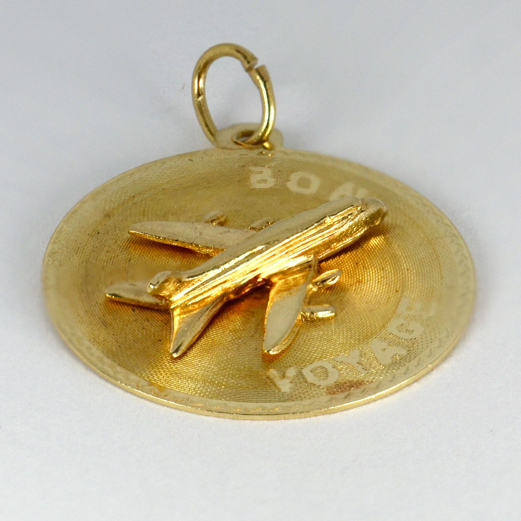 A 14 karat (14K) yellow gold charm pendant designed as a round disc supporting an airplane, with the message ‘Bon Voyage’. Stamped 14K for 14 karat gold with unknown makers marks M&M.

Dimensions: 2.6 x 2.2 x 0.45 cm (not including jump