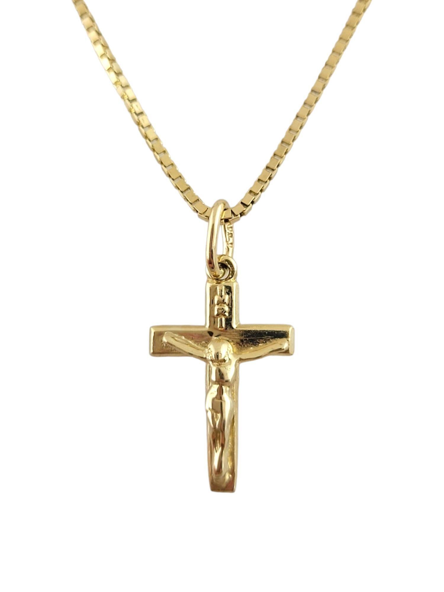 This 14K yellow gold box chain is paired with a beautiful 14K gold cross pendant!

Chain length: 16 1/2