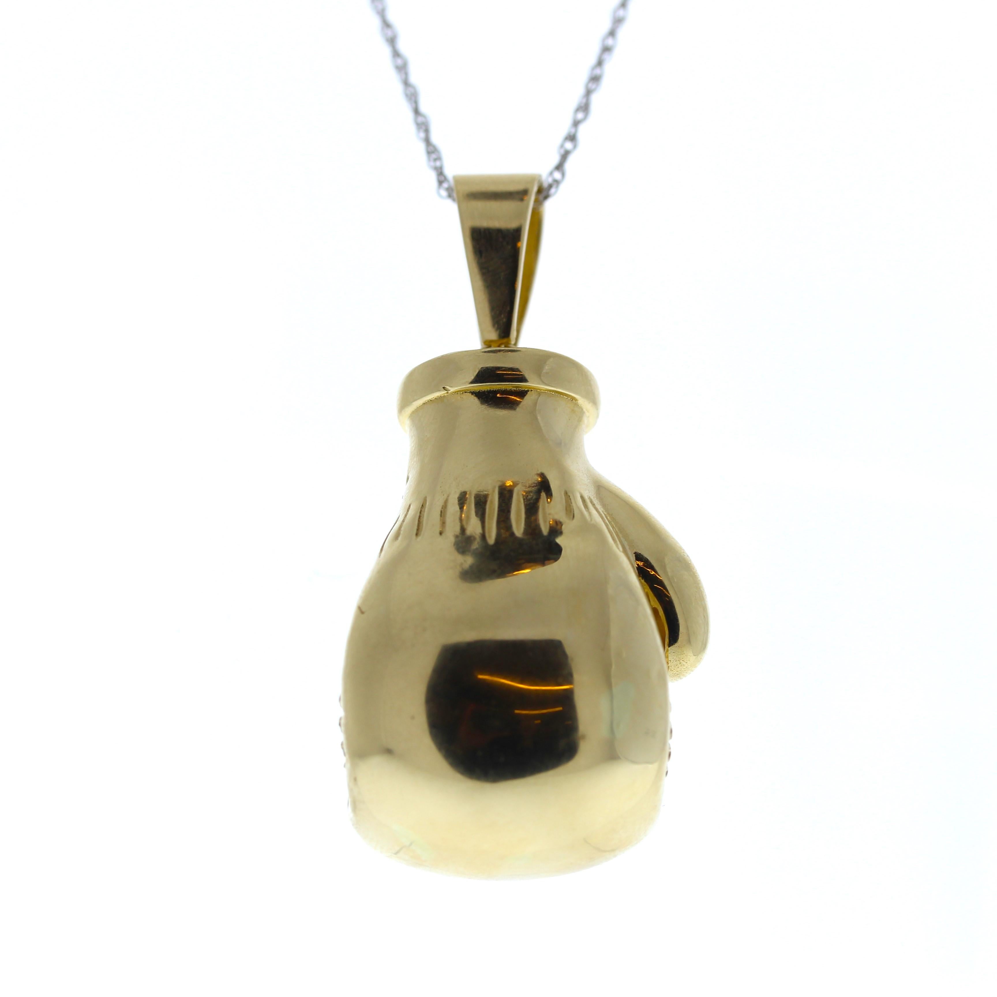 This 14K Yellow Gold fashion pendant in the shape of a boxing glove will be sure to knock your eyes out! It is unique and a perfect gift for a boxing fanatic. 