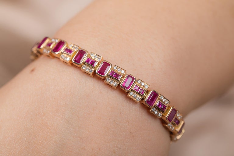 The wearing of charms may have begun as a form of amulet or talisman to ward off evil spirits or bad luck.
This ruby bracelet has a octagon cut gemstone and diamonds in 18K Gold. A perfect piece of jewelry to adorn your jewelry section.

PRODUCT