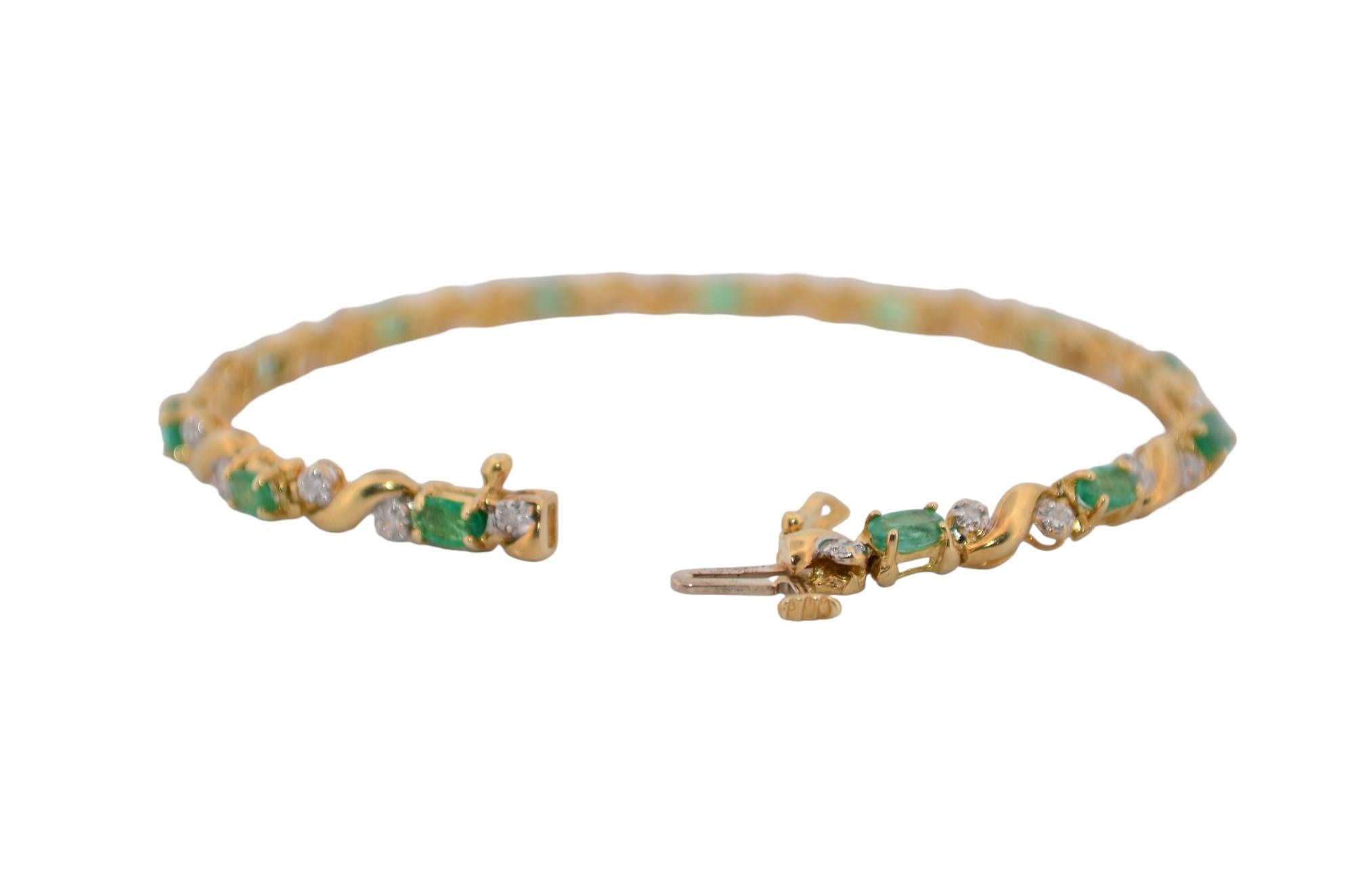 Emerald Cut 14K Yellow gold bracelet with diamonds and emeralds For Sale