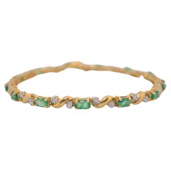 Used 14K Yellow gold bracelet with diamonds and emeralds