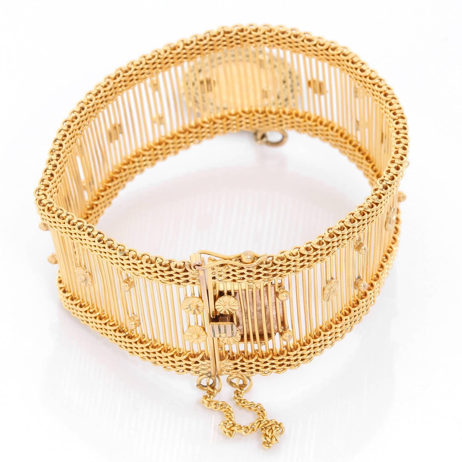 14K Yellow Gold bracelet with Mexican Peso Charm - . 14K Yellow Gold bracelet with a 2/ 1/2 peso charm in a filgree frame with safety chain. Total weight 42.7 grams. Total length  7.25