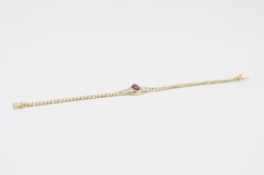 Bracelet en or jaune 14 carats avec cabochon rouge et diamants