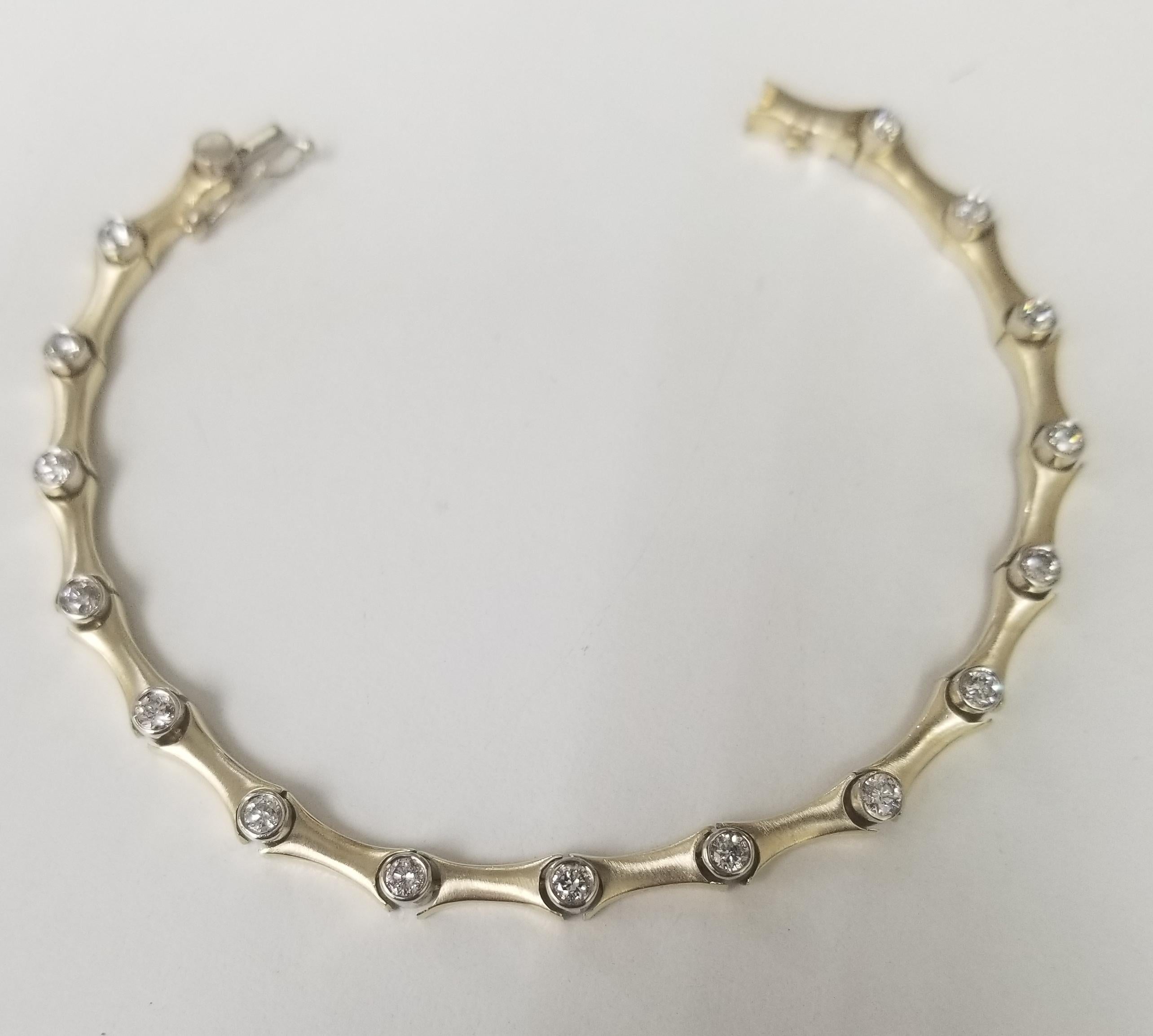 This is very beautiful 14k yellow gold custom made bracelet with round diamonds bezel set in a Matte finish. This bracelet has 16 round full cut diamonds weighing 1.25 carat total weight, G color and VS2-SI1 in clarity..
Specifications:
    main