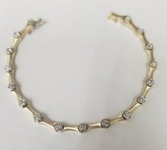 14 Karat Yellow Gold Bracelet with Round Diamonds Bezel Set in Matte Finish