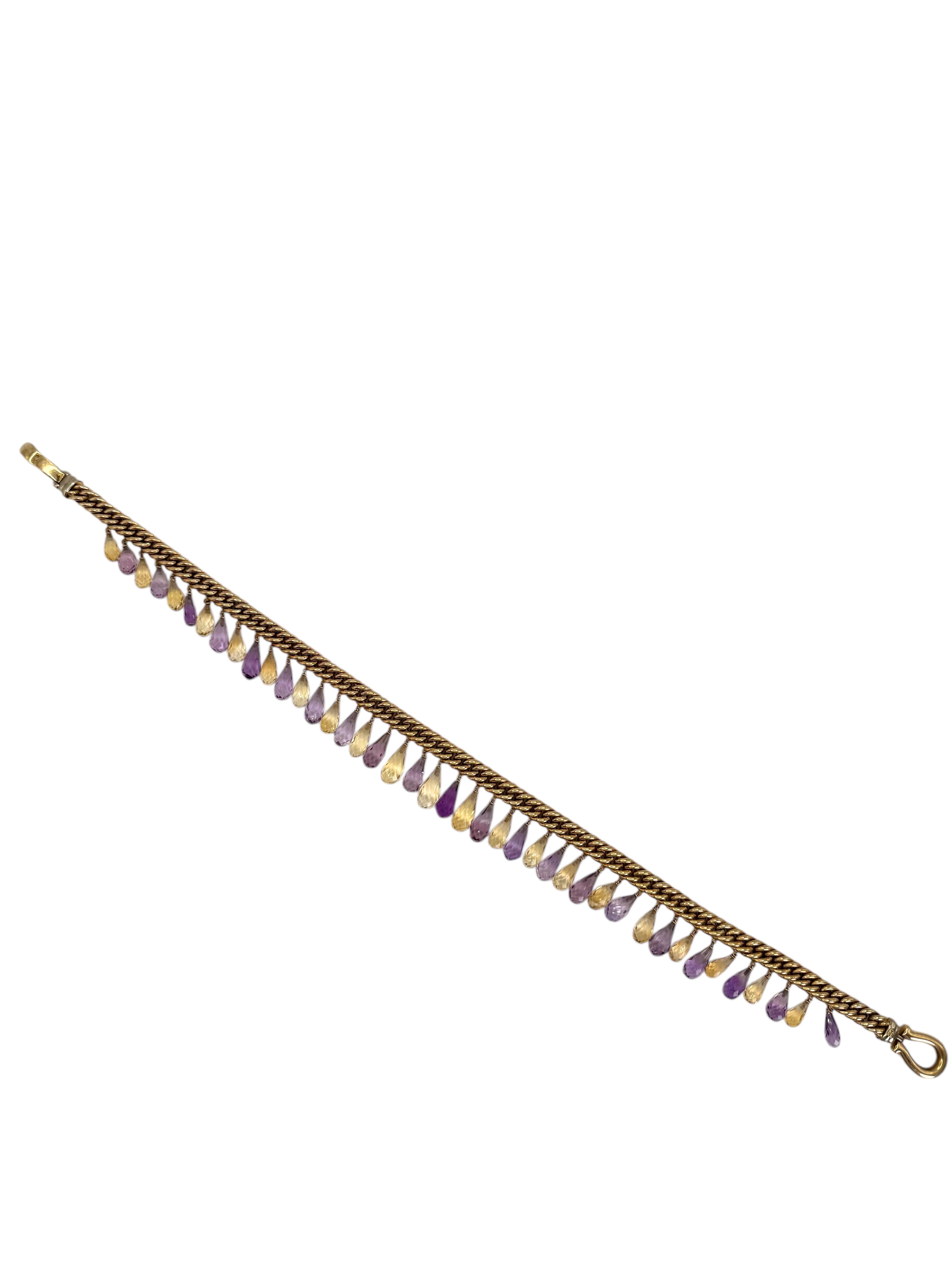 A stunning statement piece, this 14K yellow gold necklace features a bold curb link chain adorned with alternating briolette-cut amethyst and citrine drops. The vibrant purple hues of 95.69 carats of amethyst contrast beautifully with the golden