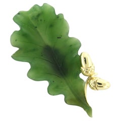 14k yellow gold brooch in the shape of a leaf set with moss agate