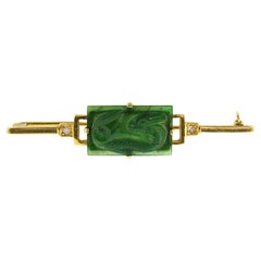 14k yellow gold brooch with a jade and single cut diamonds up to 0.03ct