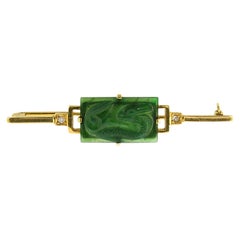 14k yellow gold brooch with a jade and single cut diamonds up to 0.03ct