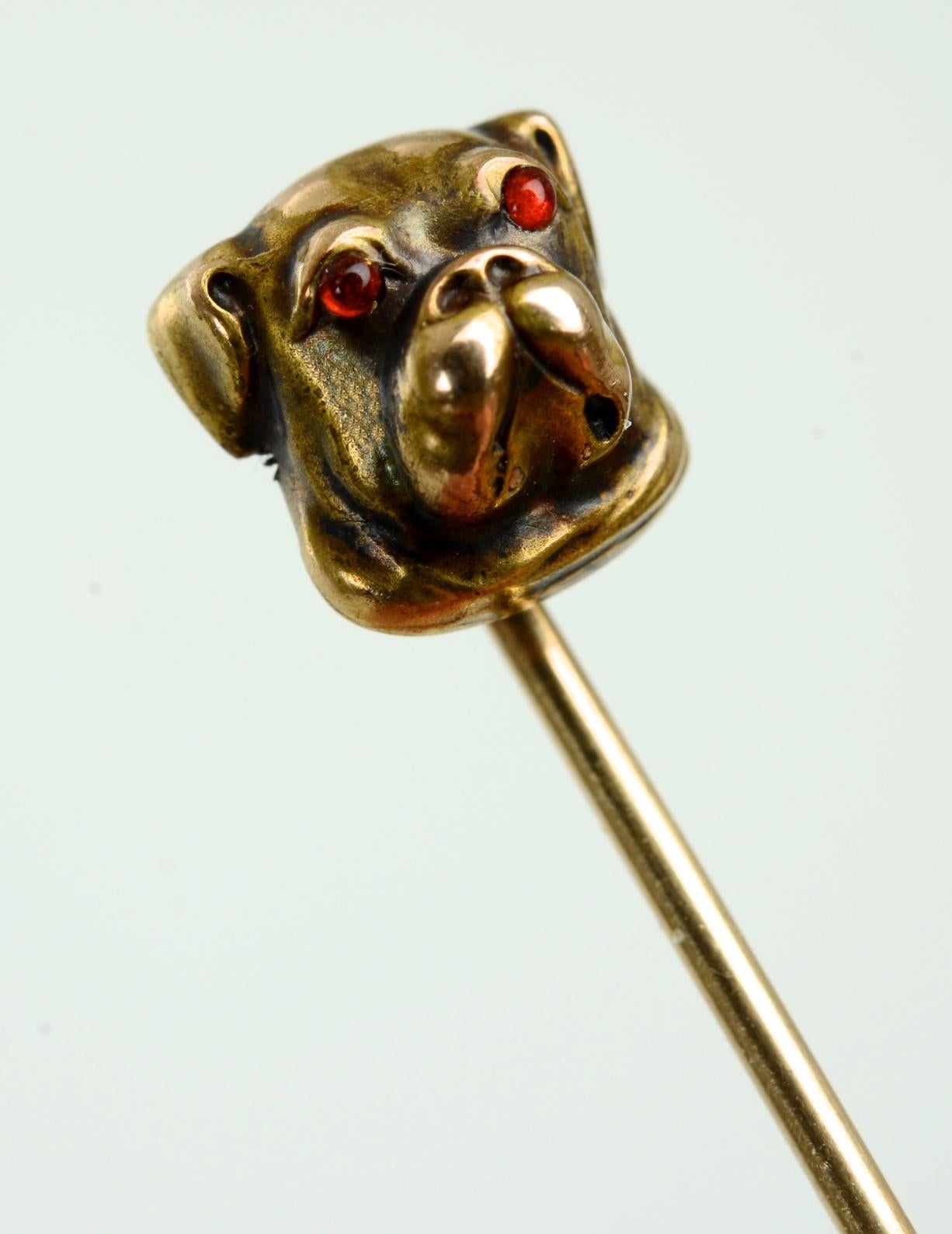 14K Yellow Gold Bull Dog Stick Pin with Cabochon Ruby Eyes. Un-marked, tested 14K gold. With beautiful patina.
N.P. Trent has been a respected name in antiques for over 30 years with a large collection of antique and vintage jewelry.