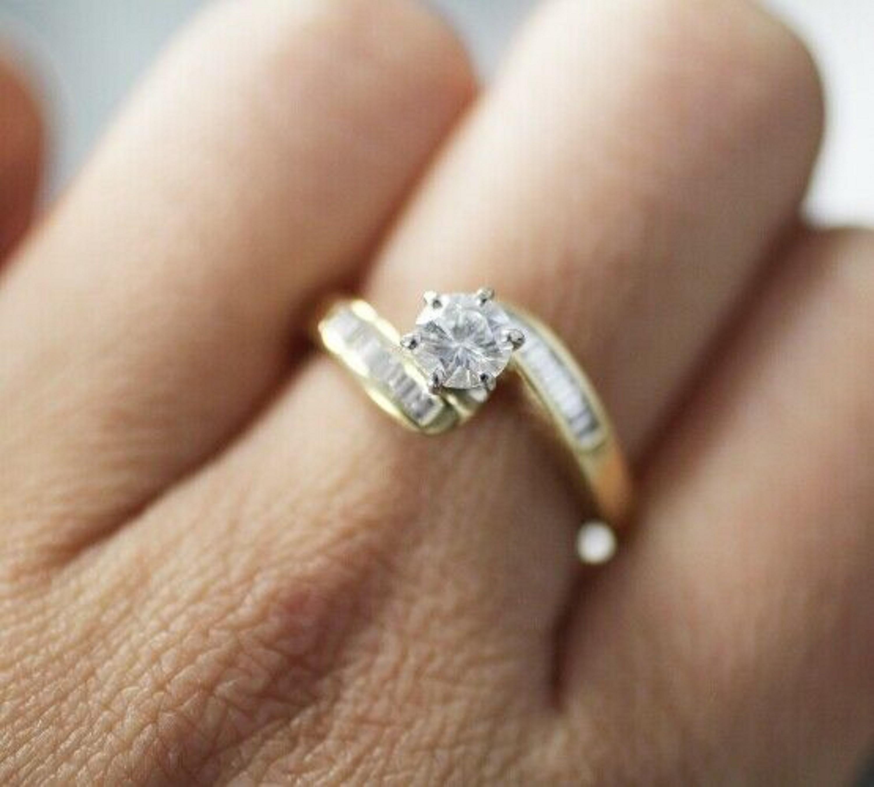 round diamond with baguettes yellow gold