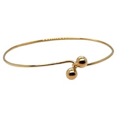 Bracciale con perline bypass in oro giallo 14k