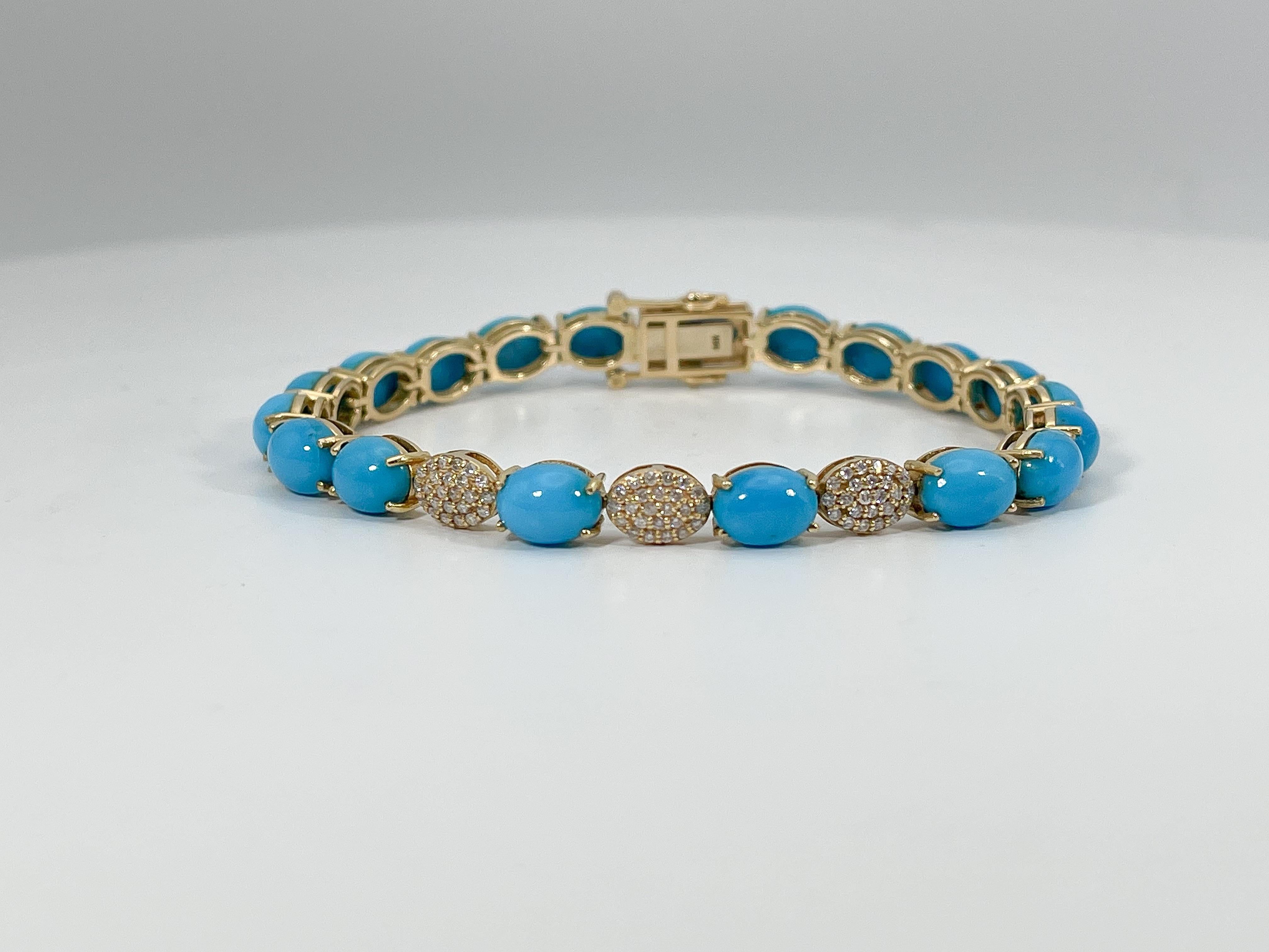 14k yellow gold .45 CTW Cabo turquoise bracelet. The turquoise stones are oval cut, the diamonds are round, forming the shape of an oval. The bracelet has a figure 8 clasp for security, the width of the bracelet is 6.1 mm, the length is 7 inches,