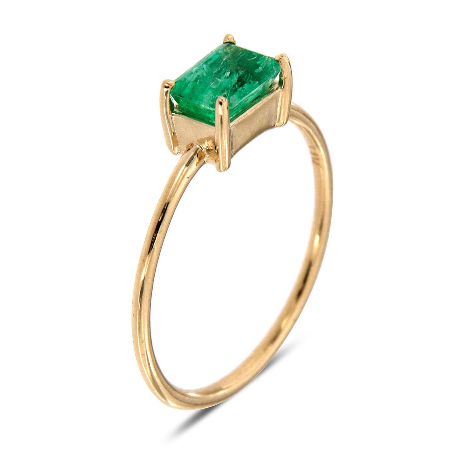 This minimalist solitaire ring features an O.60-carat Emerald Shape Colombia Green Emerald prong set on a 1.2 mm wide band. The heavily natural inclusions in the gem give it a rustic look. Experience the difference in person!

Product details: