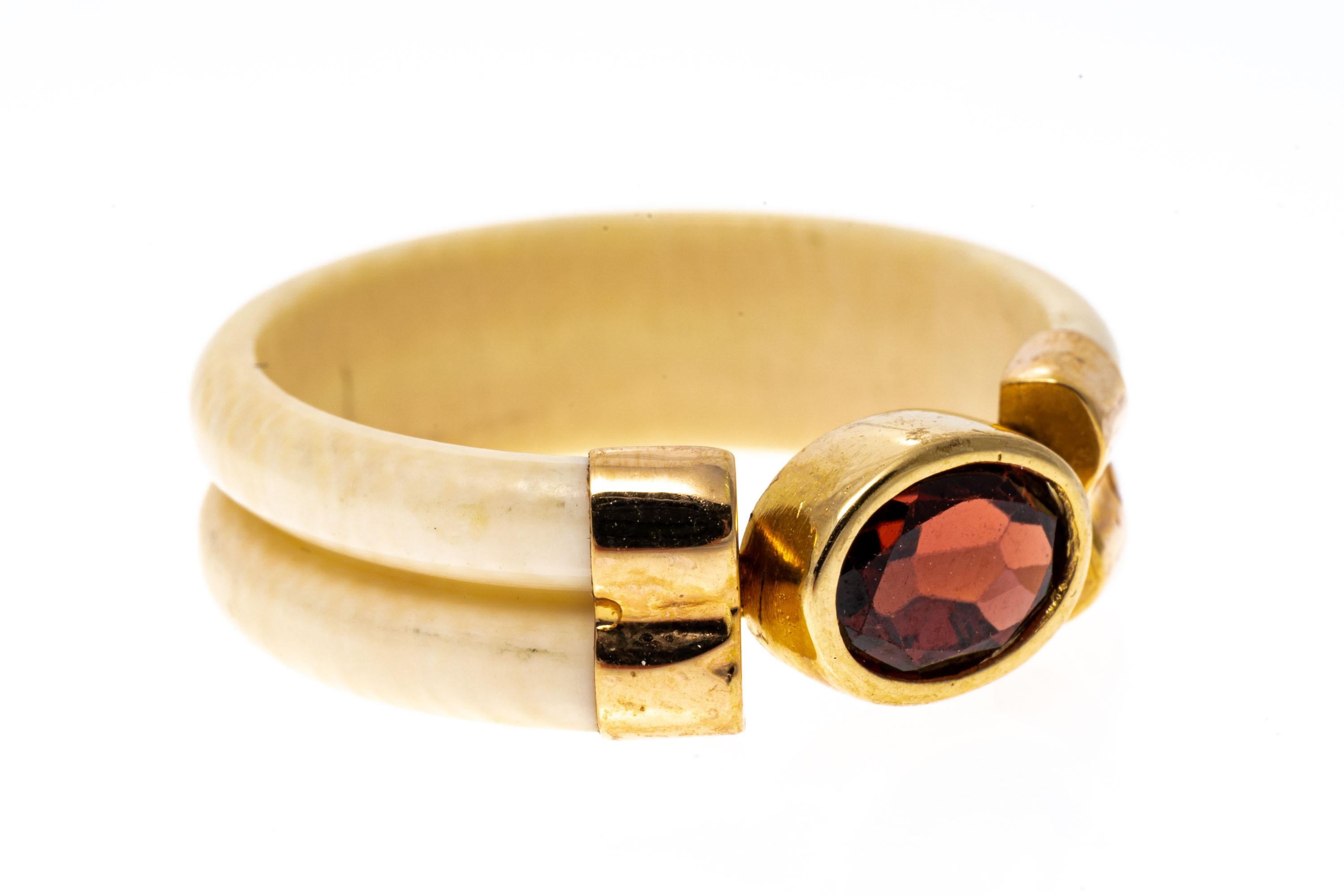 Modern 14k Yellow Gold Carved Bone And Bezel Set Garnet Band Ring, Size 7.25 For Sale