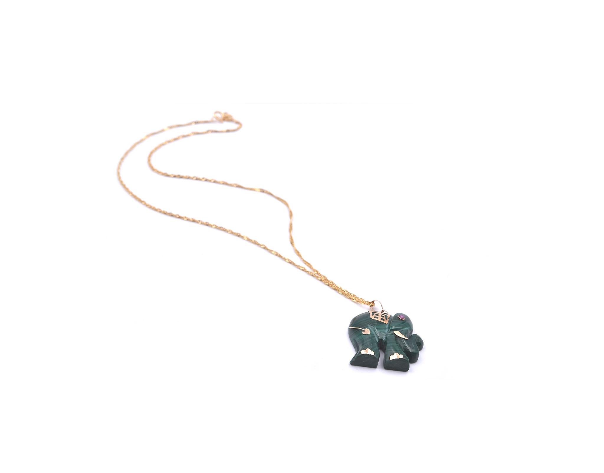 Designer: custom designed
Material: 14k yellow gold
Dimensions: necklace is 16-inches long, jade elephant is 24mm wide and 1 ¼ inches long
Weight: 10.22 grams
