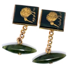 Gemelli in oro giallo 14k con disegno di kiwi intagliato e giada