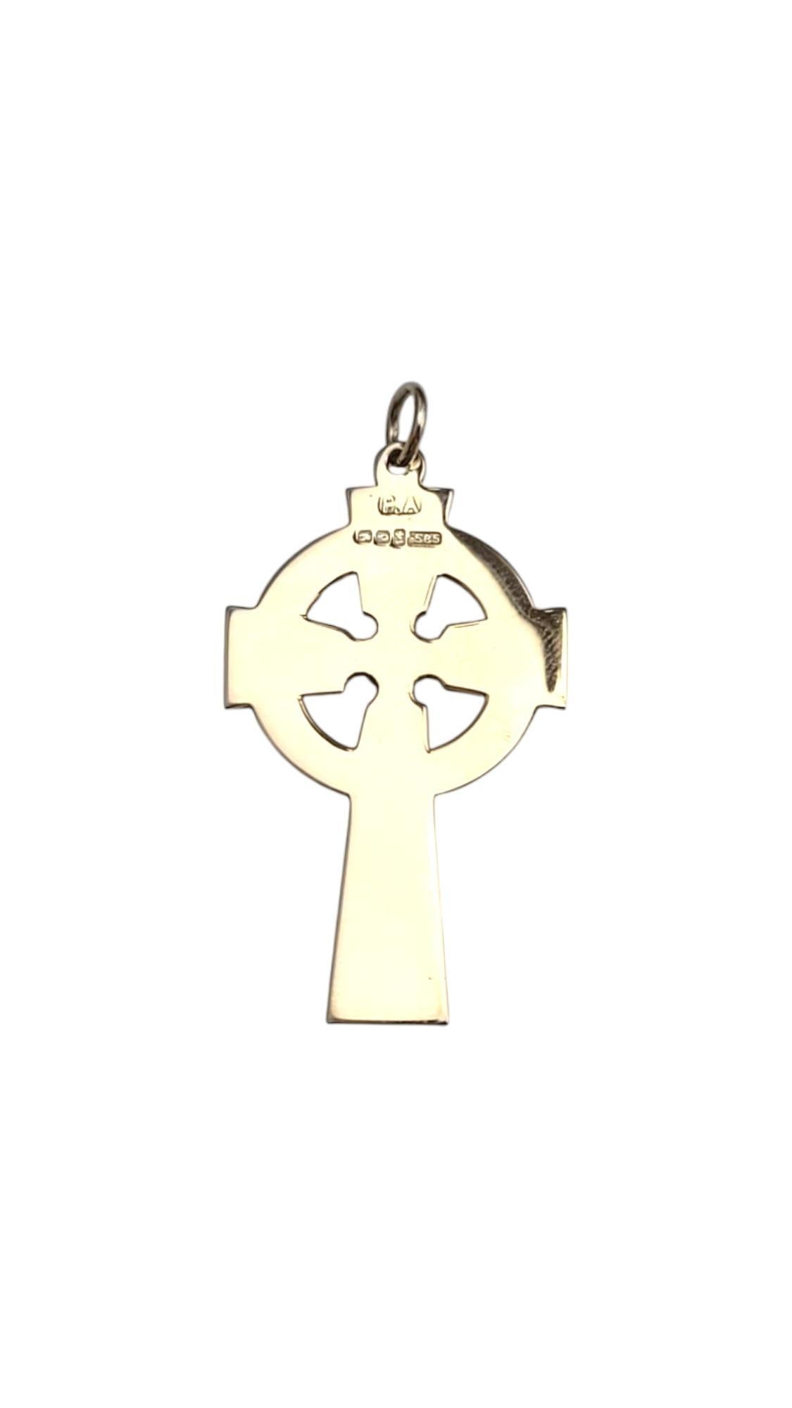 14K Yellow Gold Celtic Cross Pendant-

This elegant 14k yellow gold cross pendant combines timeless design with a radiant finish, making it a perfect symbol of faith and style. Its sleek, polished surface enhances any necklace, offering a versatile