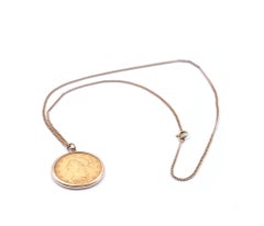 14 Karat Yellow Gold Chain and Liberty Coin Pendant
