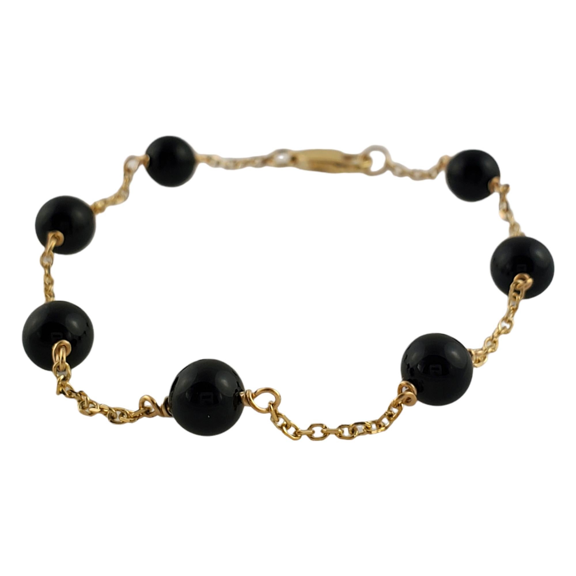 Vintage 14K Yellow Gold black Bead Bracelet

Beautiful gold chain bracelet with black bead detailing!

7 round black beads

Size: 7 inches with tape measure, 6.5 inches on bracelet cone closed

Weight: 3.4 g/ 2.1 dwt

Hallmark: 14K

Very good