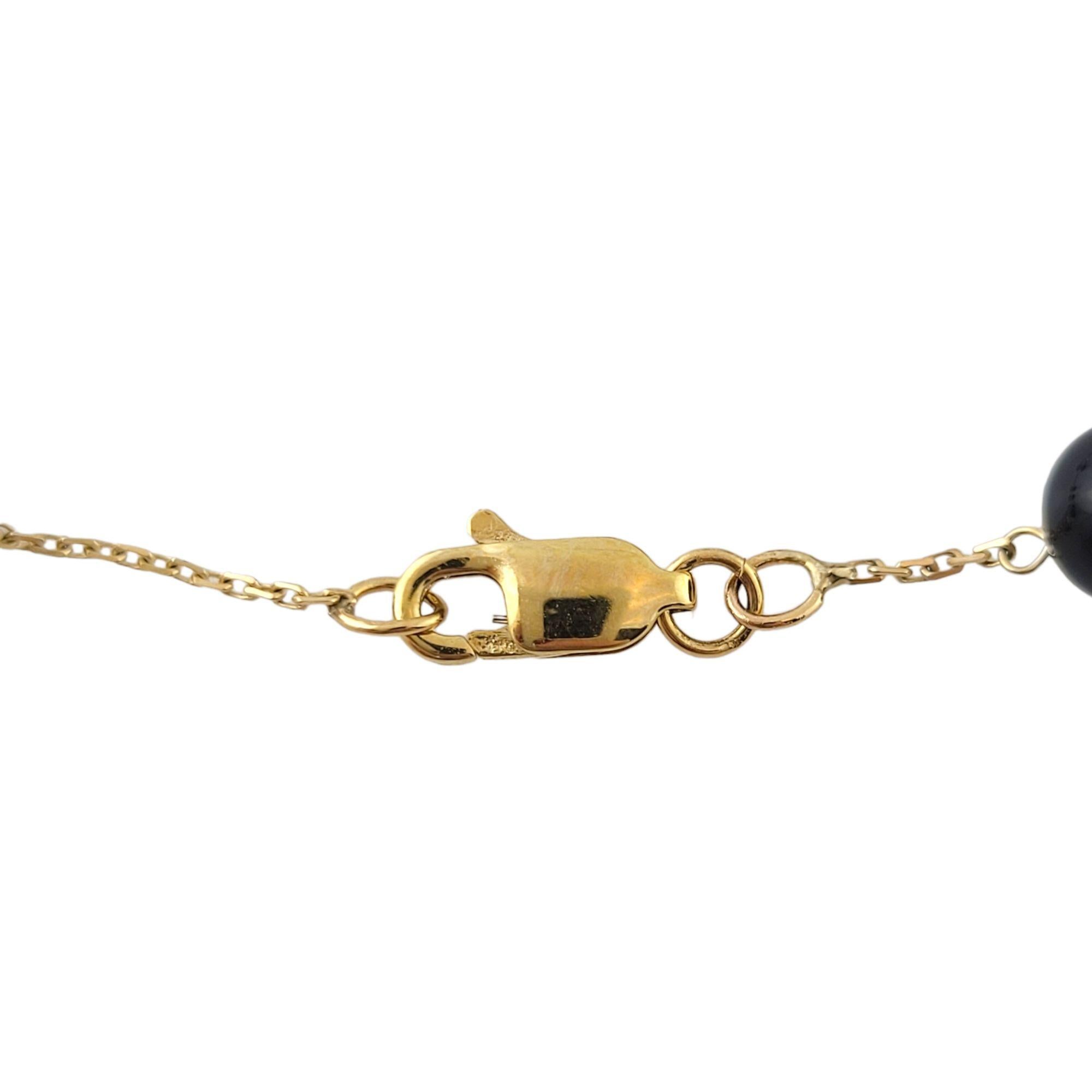 Vintage 14K Yellow Gold Chain & Black Onyx Necklace

12 gorgeous black onyx beads on a 14K yellow gold chain!

Chain length: 14 1/4