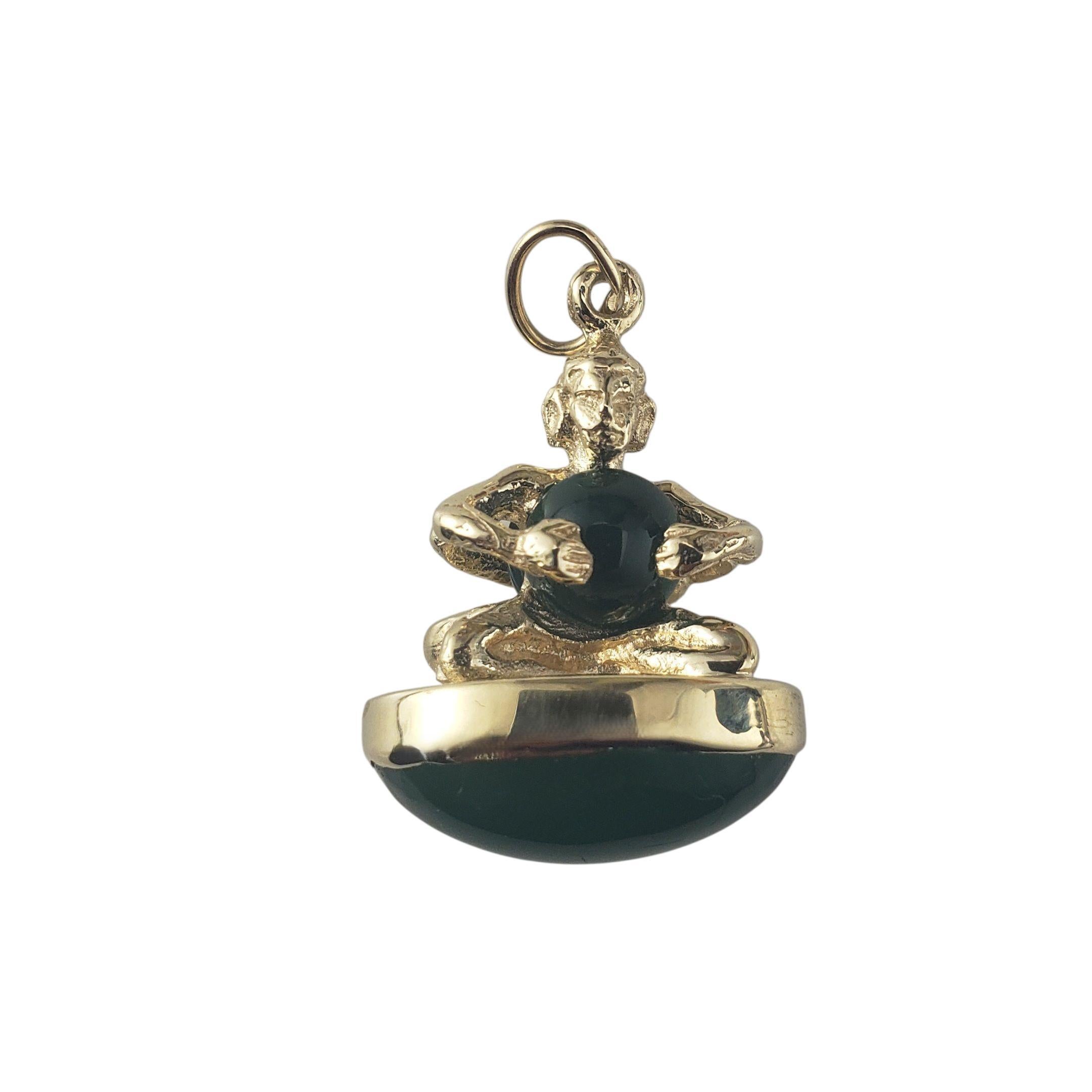 14K Yellow Gold Chalcedony Double-Sided Figure Pendant JAGi Certified-

Unique and eye-catching, this 14K yellow gold pendant features a sculpted figure holding a round green chalcedony orb, seated atop a matching oval cabochon. The design is